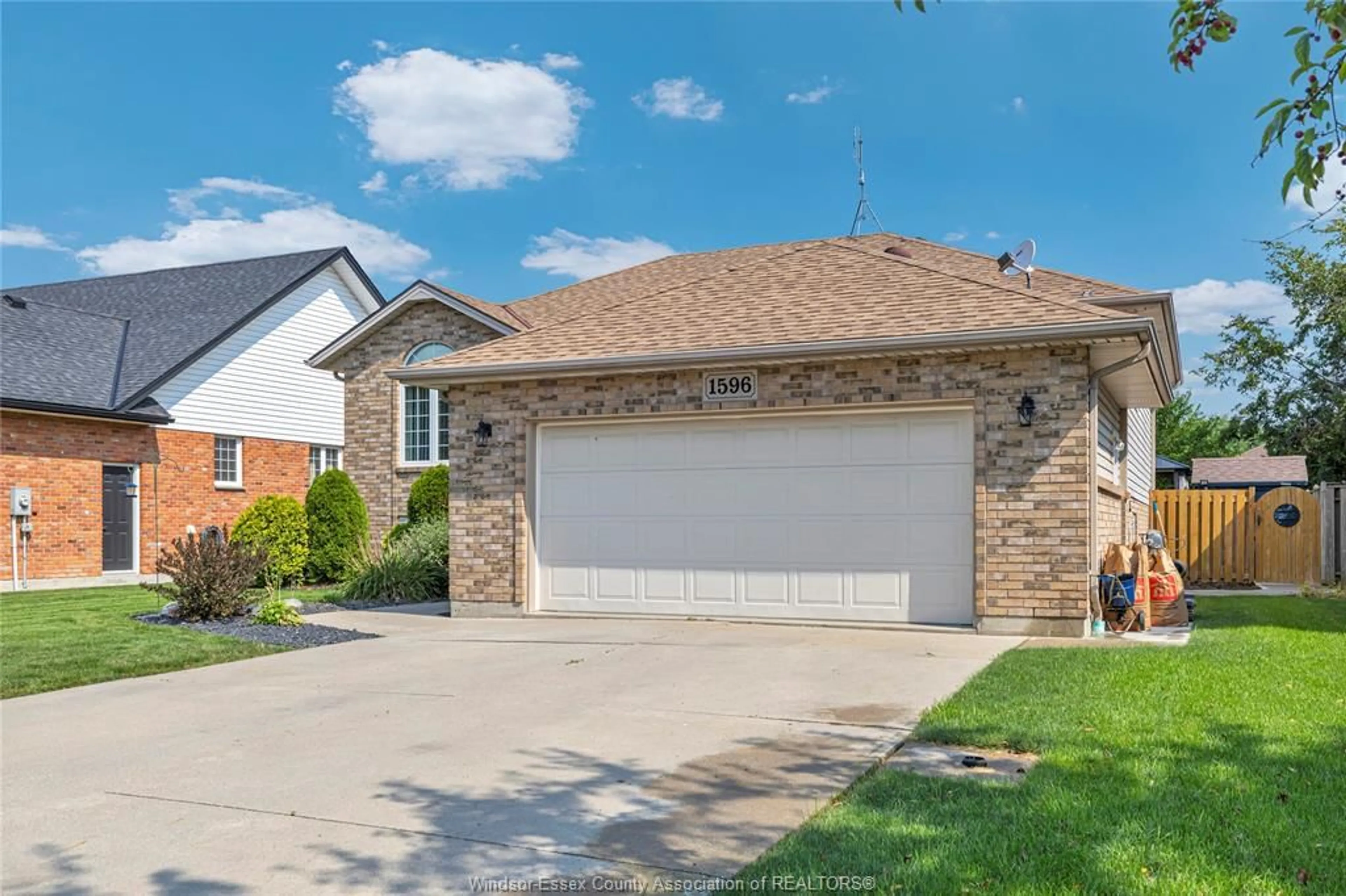 Home with brick exterior material, street for 1596 WHITEWOOD Dr, Lakeshore Ontario N0R 1A0