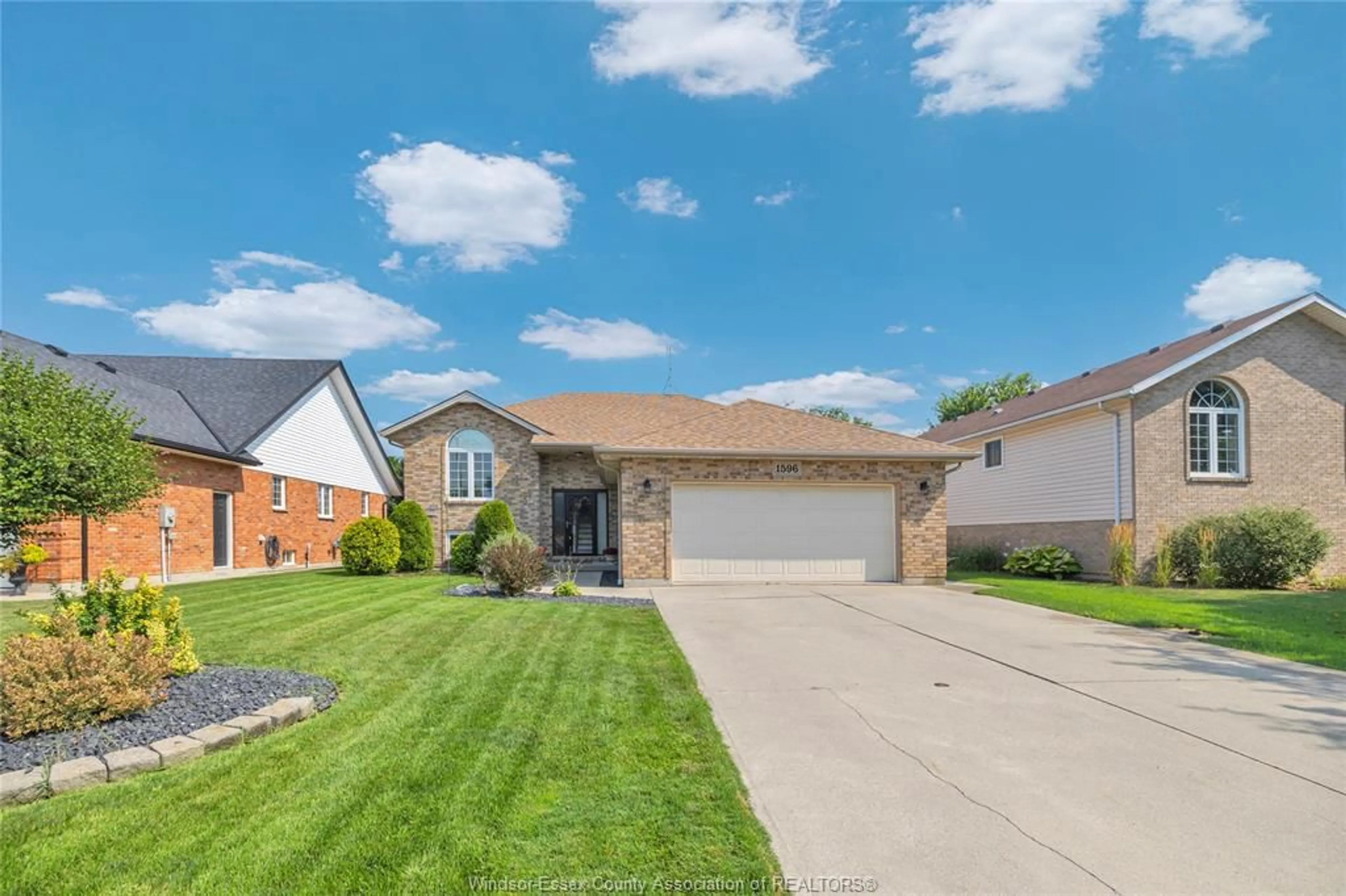 Home with brick exterior material, street for 1596 WHITEWOOD Dr, Lakeshore Ontario N0R 1A0