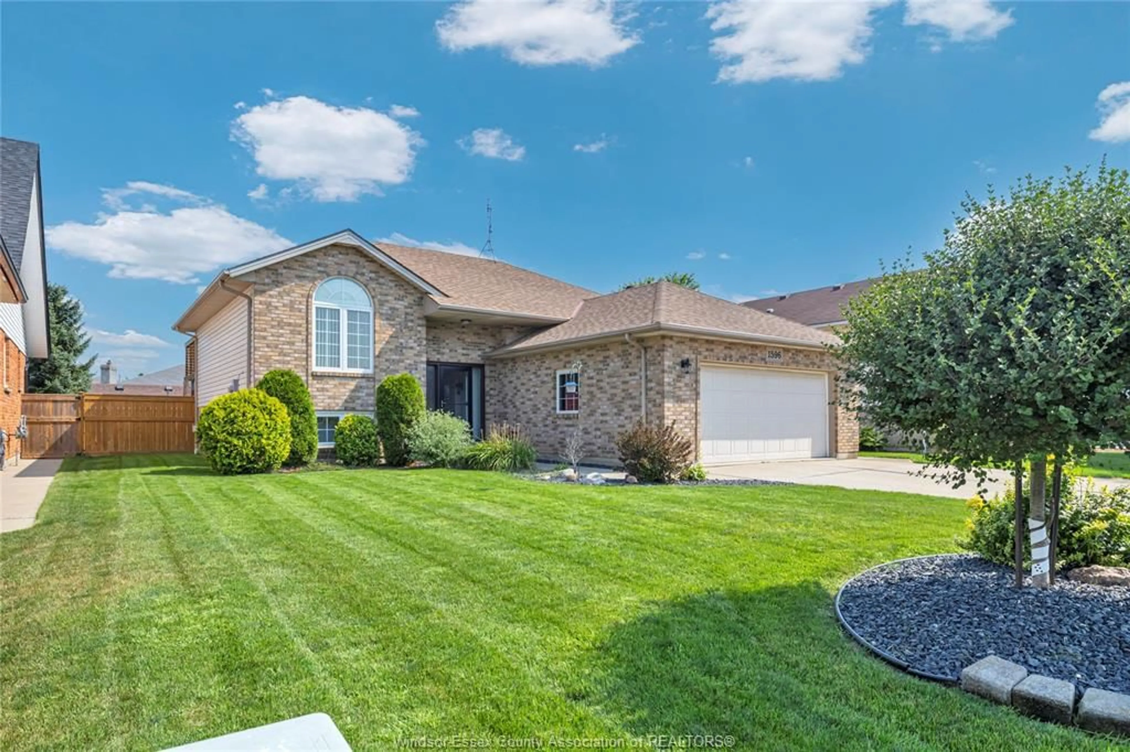 Home with brick exterior material, street for 1596 WHITEWOOD Dr, Lakeshore Ontario N0R 1A0