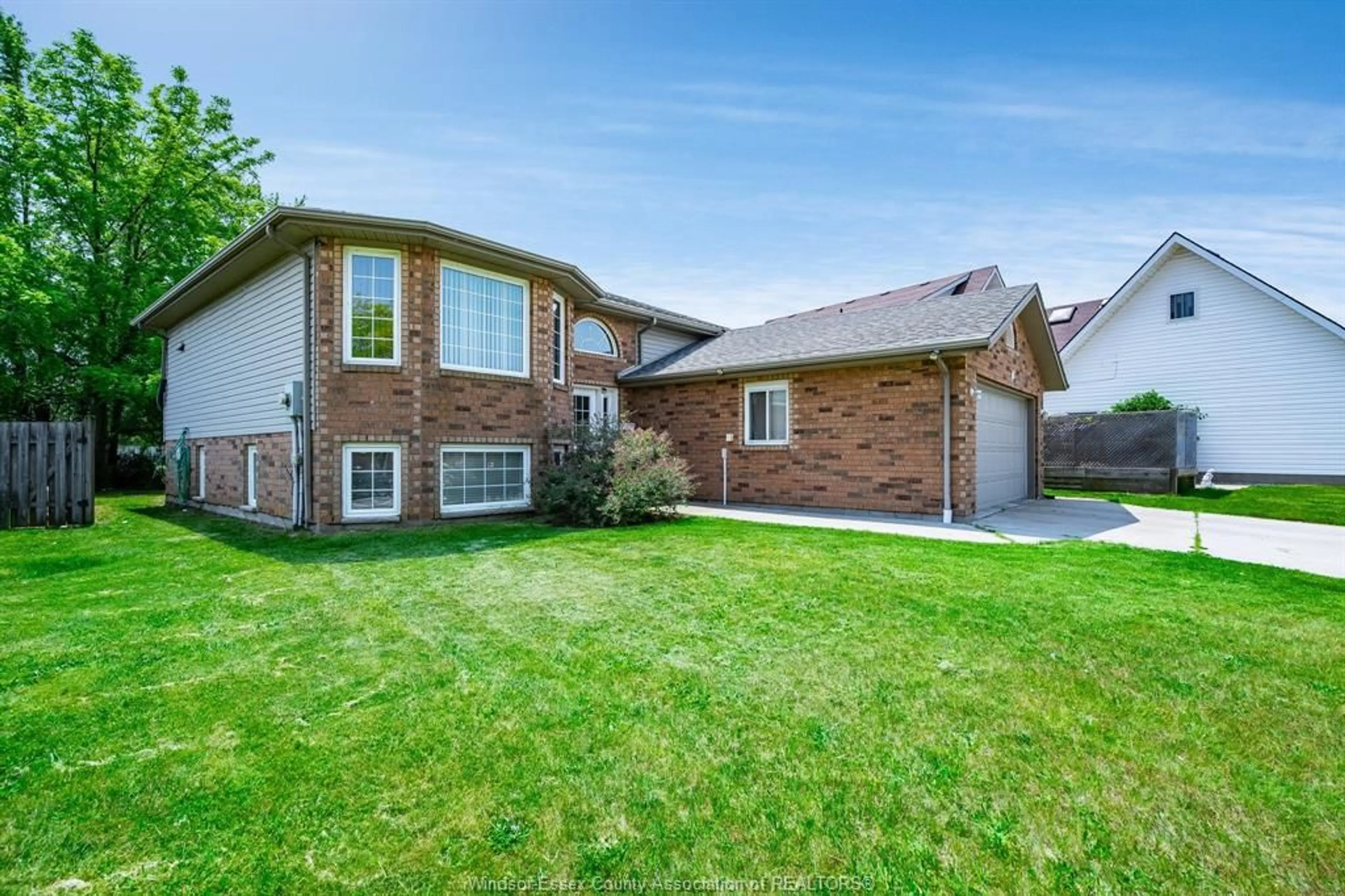 Home with brick exterior material, street for 166 STURGEON MEADOWS, Leamington Ontario N8H 5M7