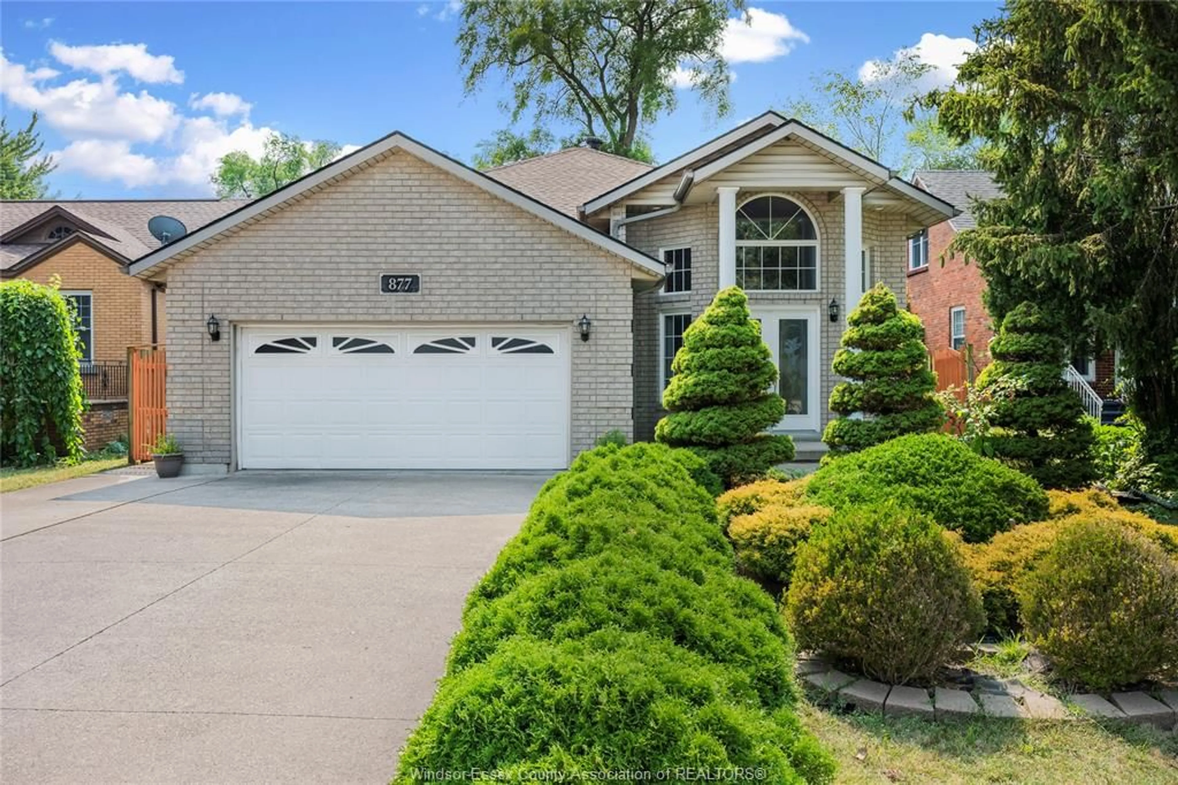 Home with brick exterior material, street for 877 LAUZON RD, Windsor Ontario N8S 3M4