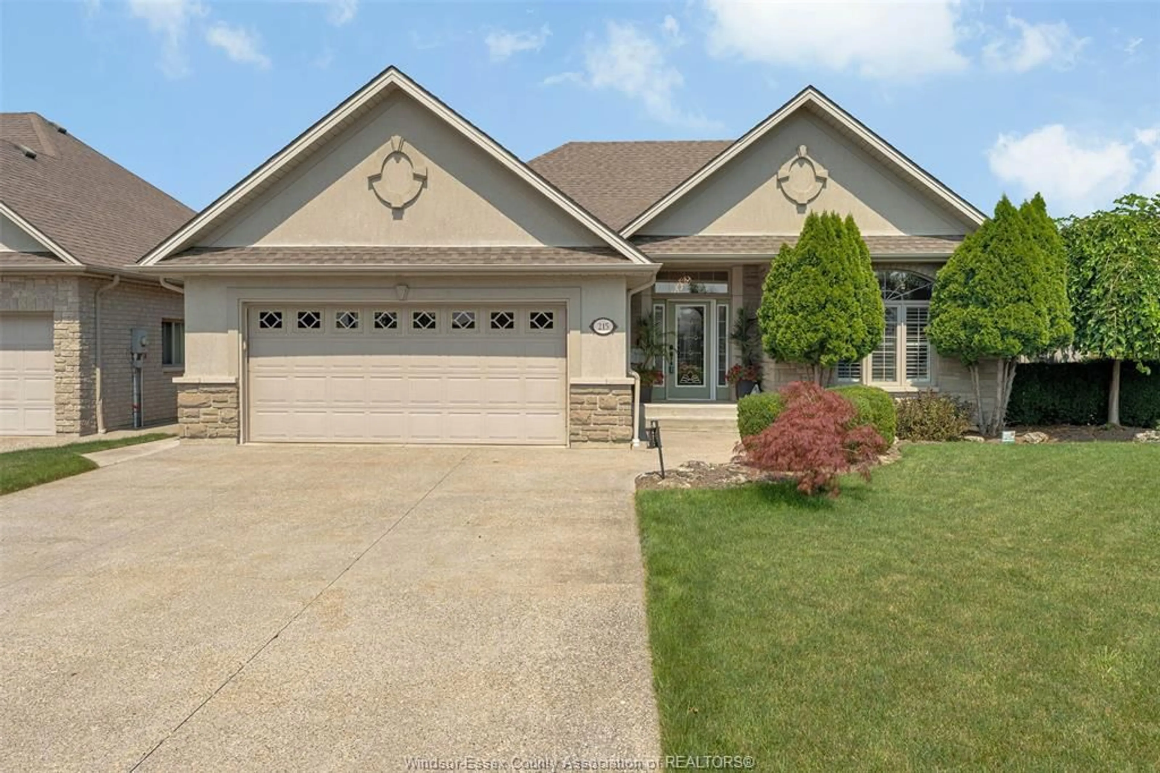 Home with brick exterior material, street for 215 JOAN FLOOD Dr, Essex Ontario N8M 0A2