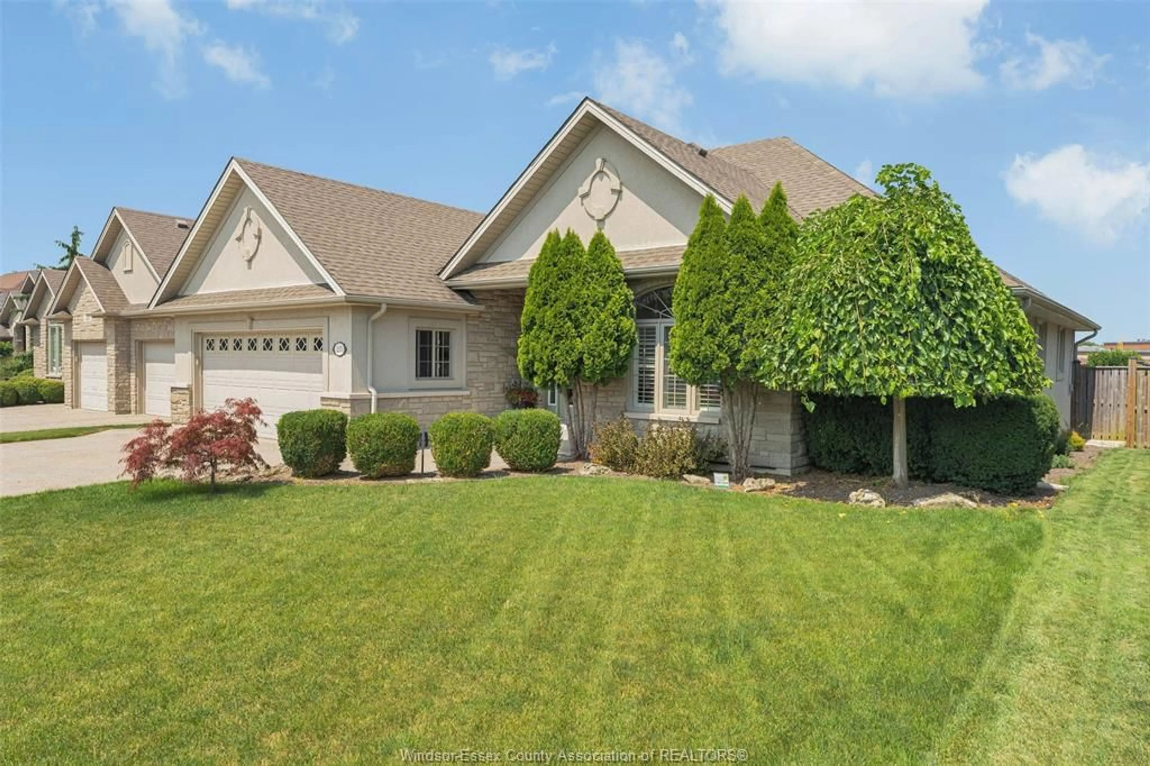Home with vinyl exterior material, street for 215 JOAN FLOOD Dr, Essex Ontario N8M 0A2