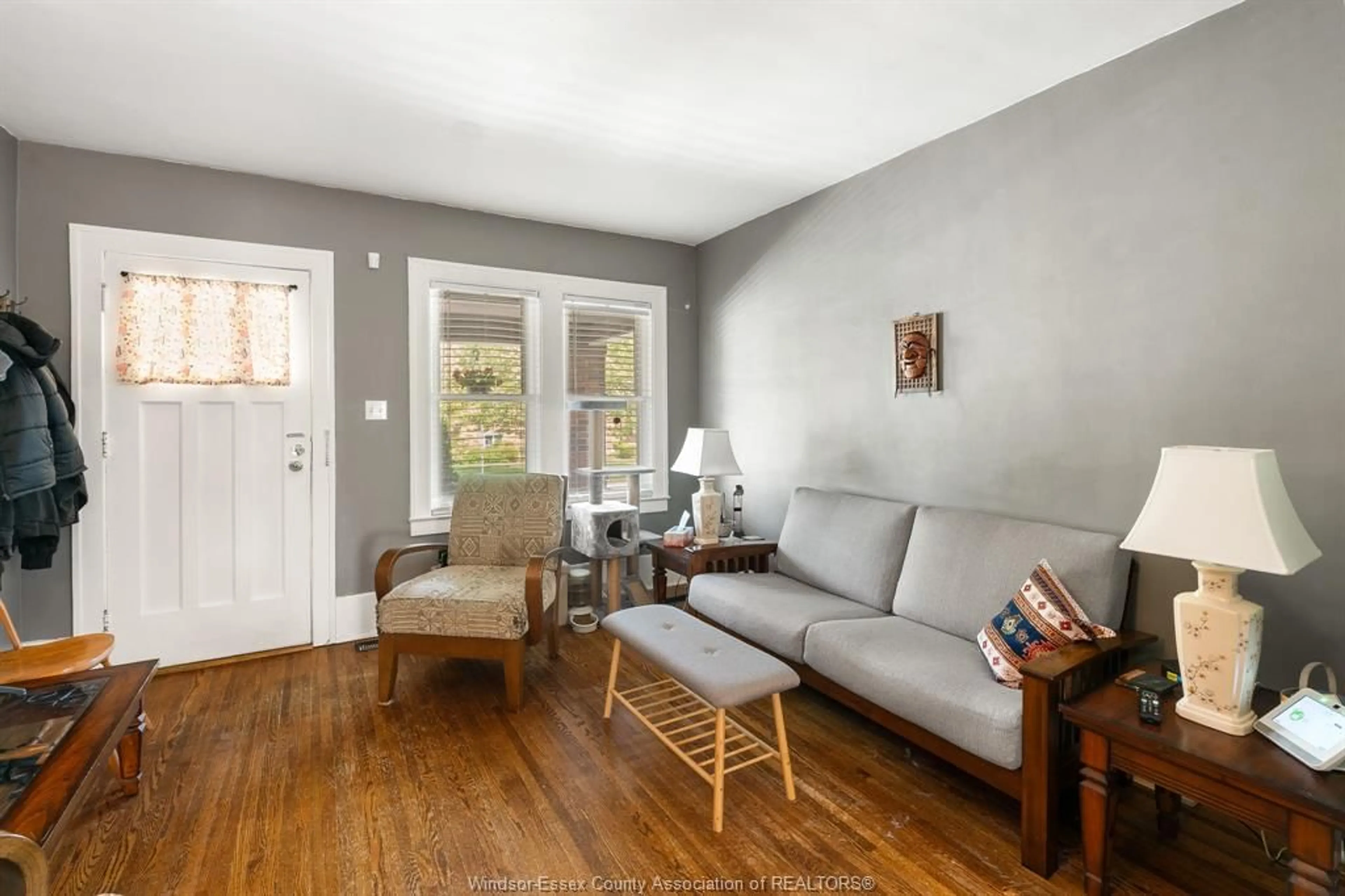 Living room with furniture, wood/laminate floor for 1737 LINCOLN RD, Windsor Ontario N8W 2P6