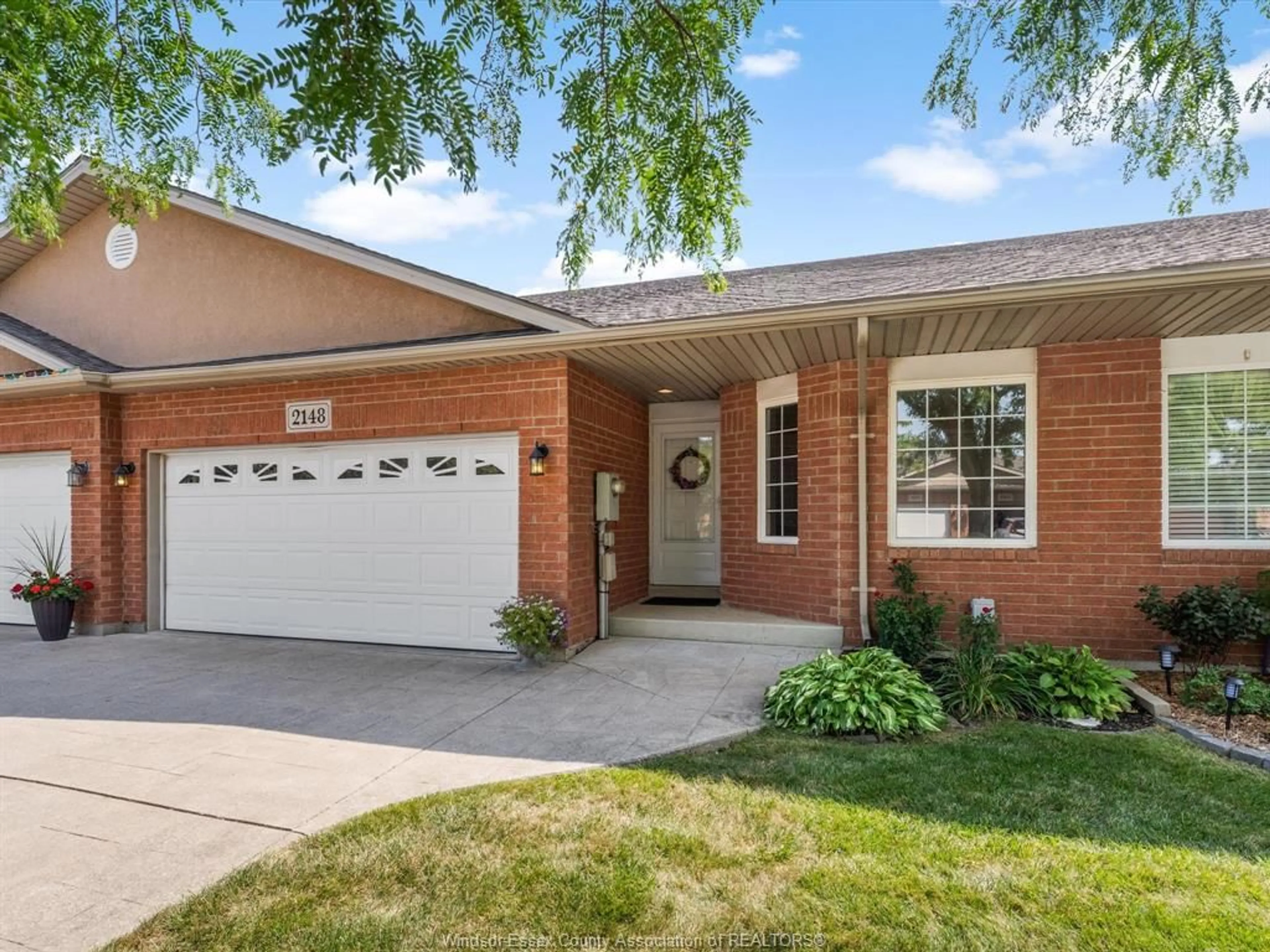 Home with brick exterior material, street for 2148 Luxury Ave, Windsor Ontario N8P 1W9