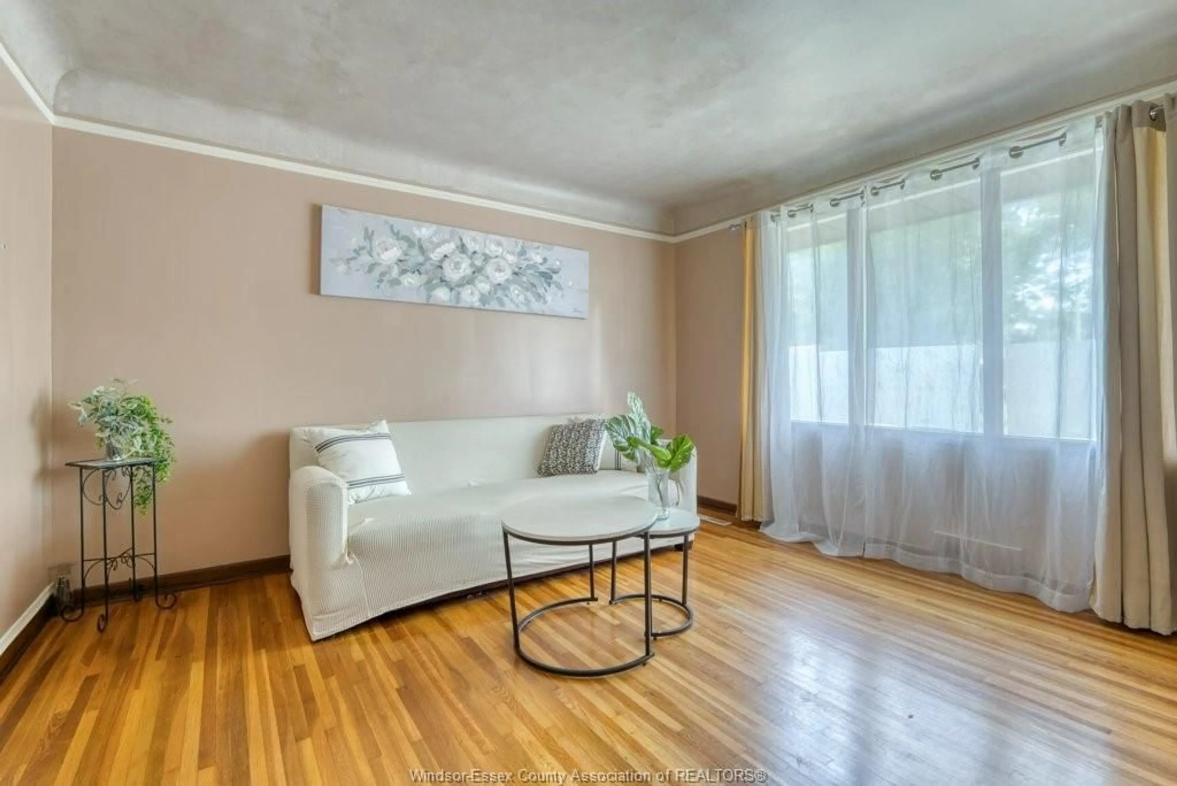 Living room with furniture, wood/laminate floor for 3277 DOMINION, Windsor Ontario N9E 2N6