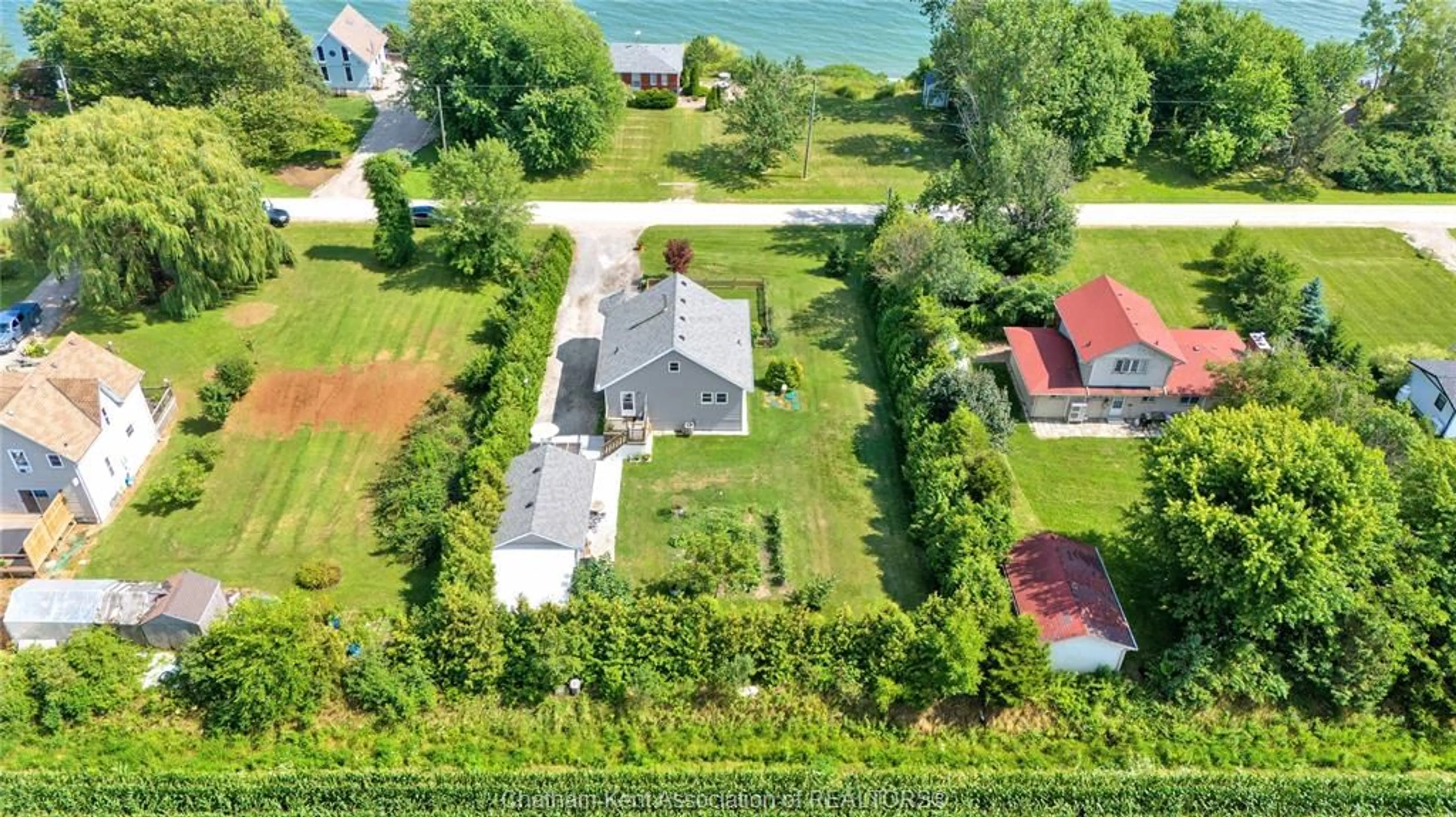 A pic from outside/outdoor area/front of a property/back of a property/a pic from drone, water/lake/river/ocean view for 1311 Bluff Line, Wheatley Ontario N0P 2C0