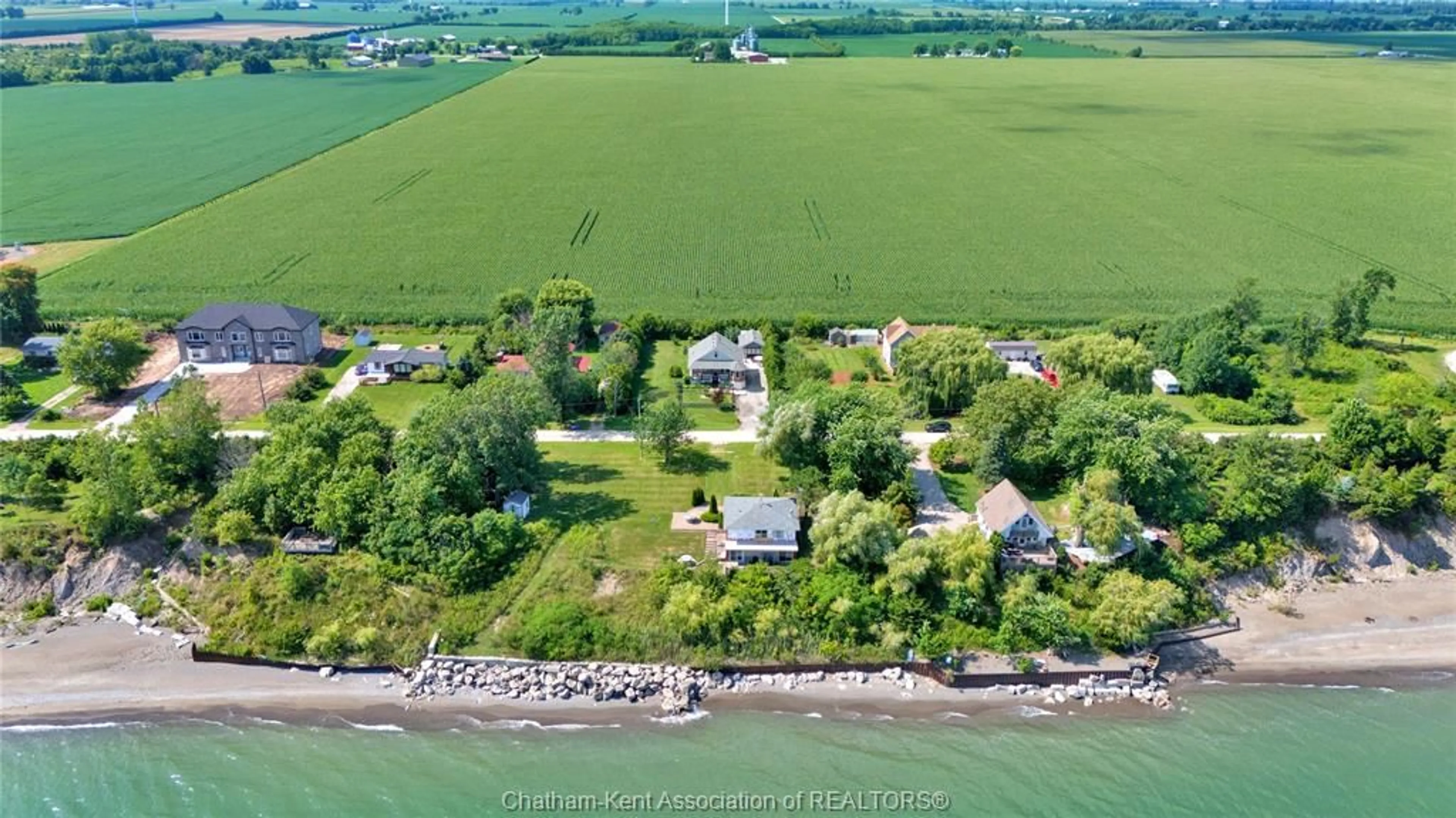 A pic from outside/outdoor area/front of a property/back of a property/a pic from drone, water/lake/river/ocean view for 1311 Bluff Line, Wheatley Ontario N0P 2C0