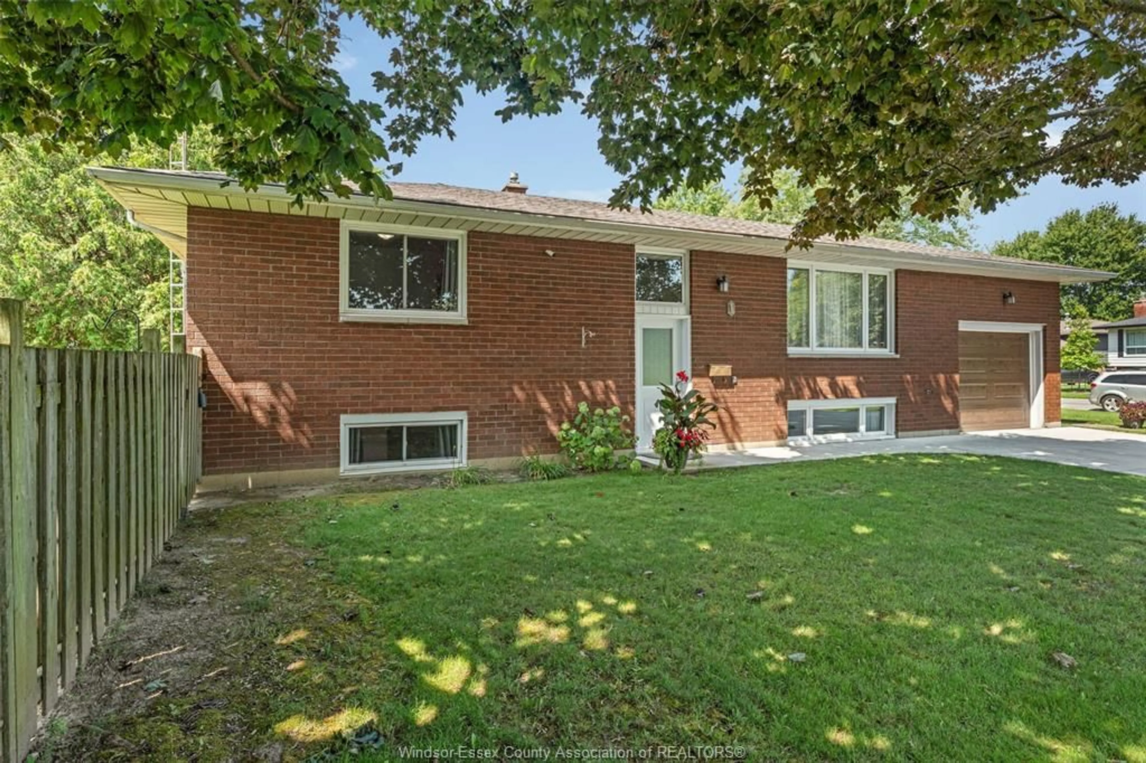 Home with brick exterior material, street for 1 SUTTON Dr, Leamington Ontario N8H 4P3