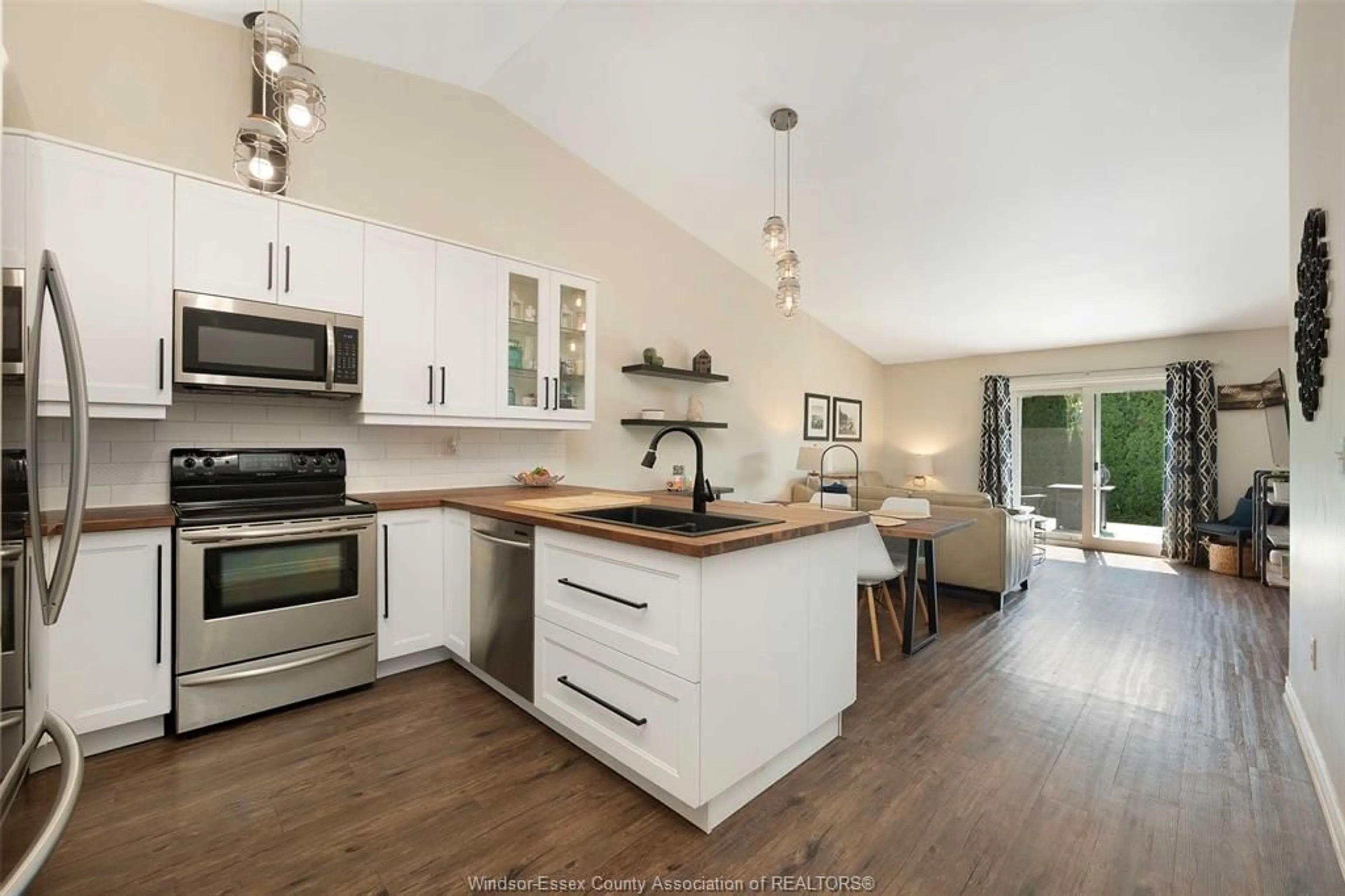 Open concept kitchen, wood/laminate floor for 3771 PRAIRIE Crt, Windsor Ontario N9G 2X4