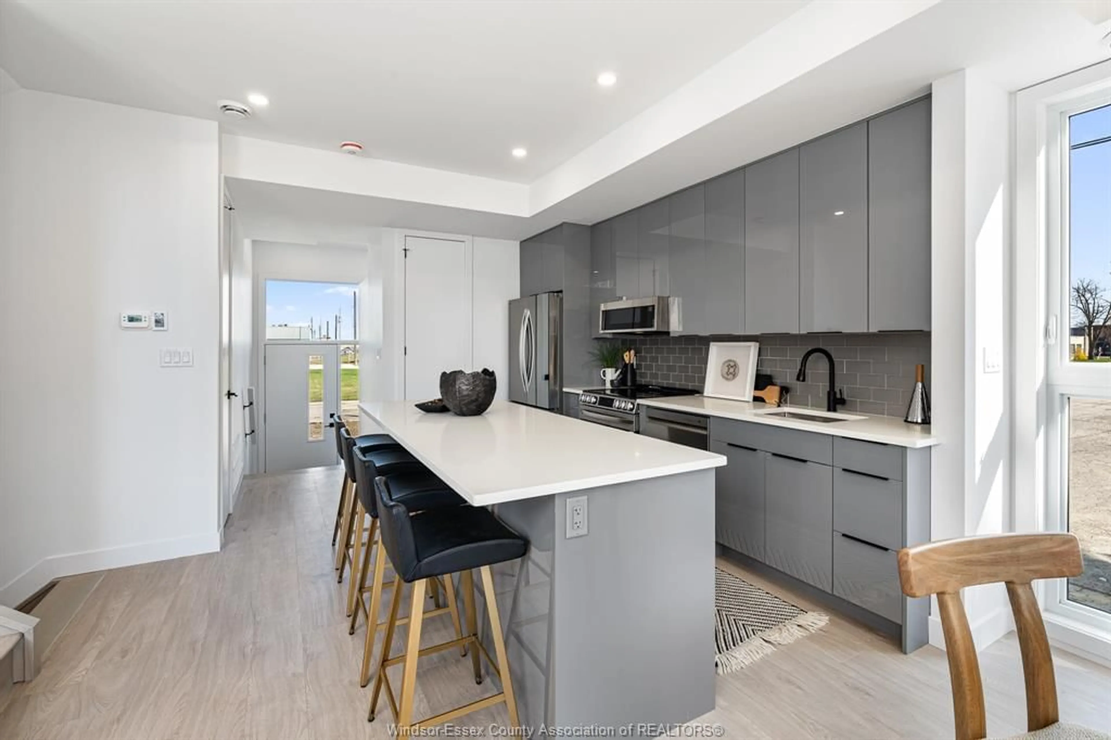 Open concept kitchen, ceramic/tile floor for 2035-2031 SENECA St, Windsor Ontario N8W 2Z9