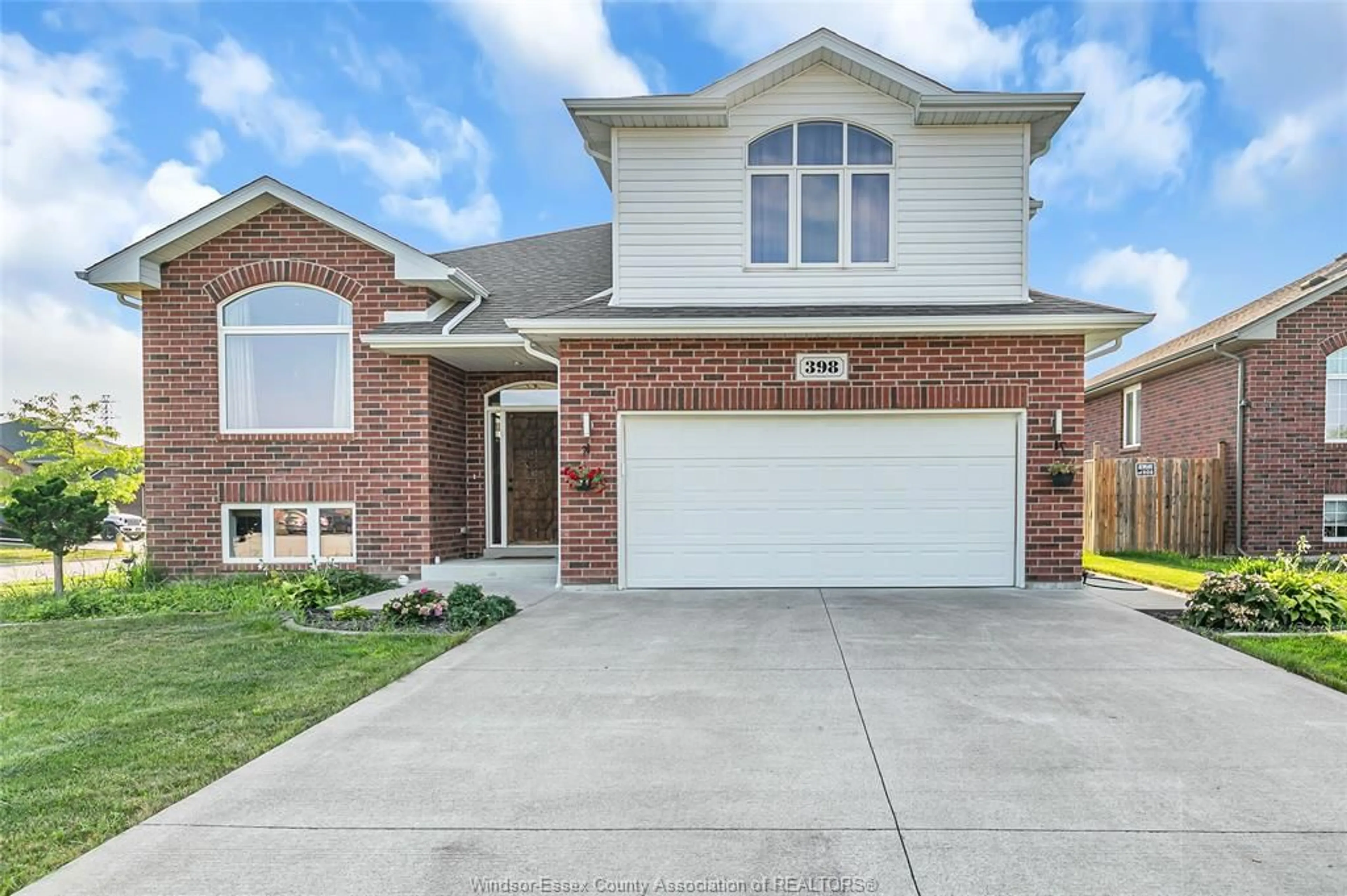 Home with brick exterior material, street for 398 POPLAR Dr, Lakeshore Ontario N0R 1A0