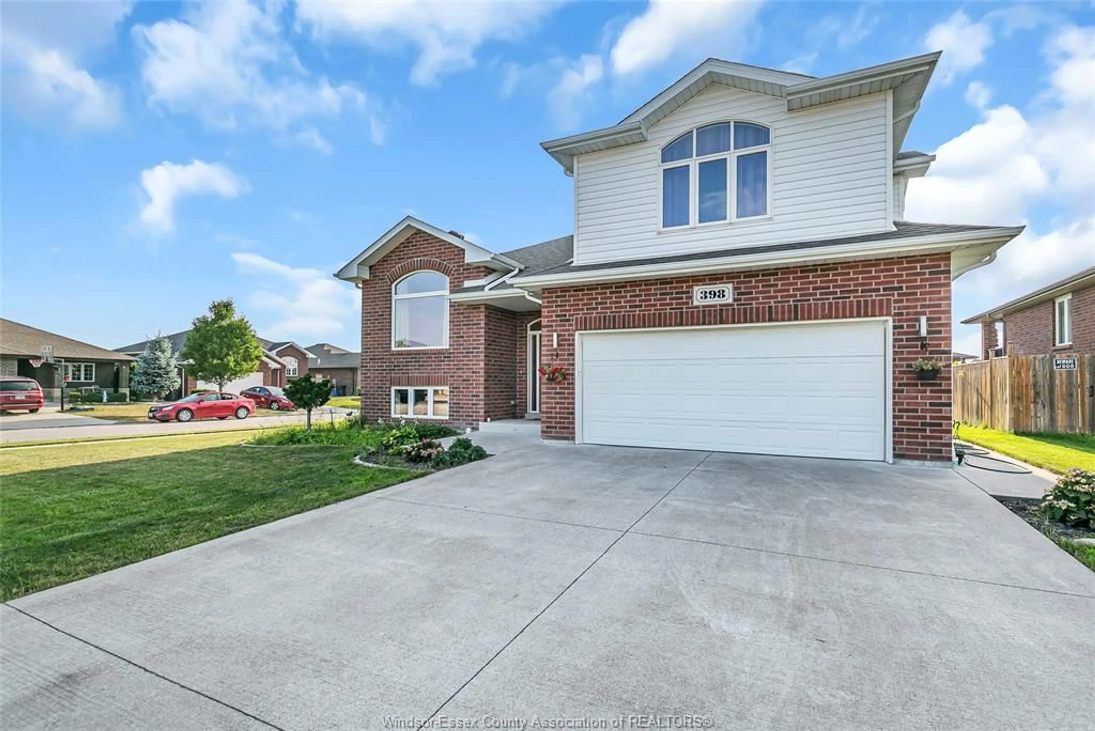 Home with brick exterior material, street for 398 POPLAR Dr, Lakeshore Ontario N0R 1A0