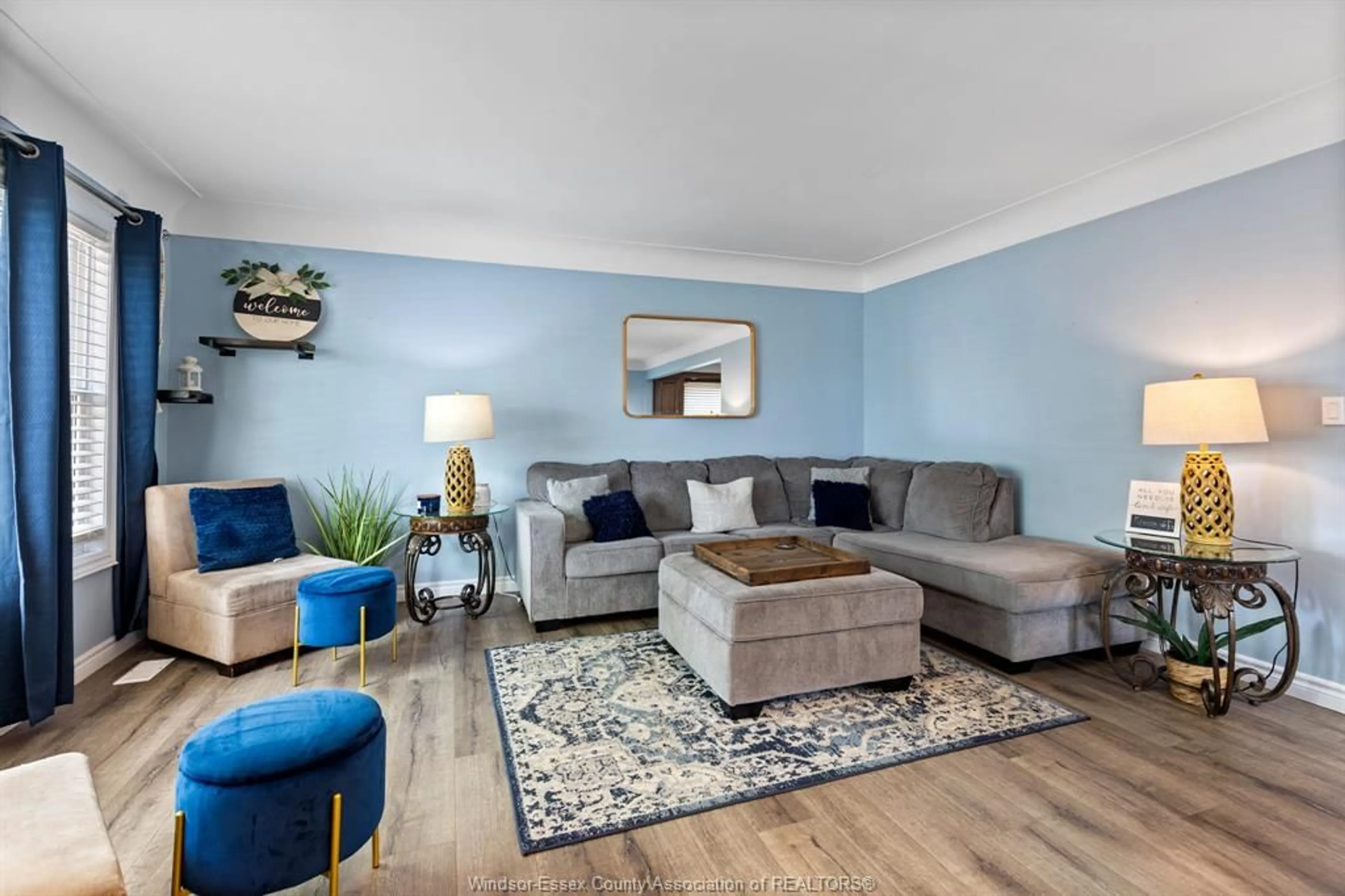 Living room with furniture, wood/laminate floor for 819 ROSSINI Blvd, Windsor Ontario N8Y 2Z2