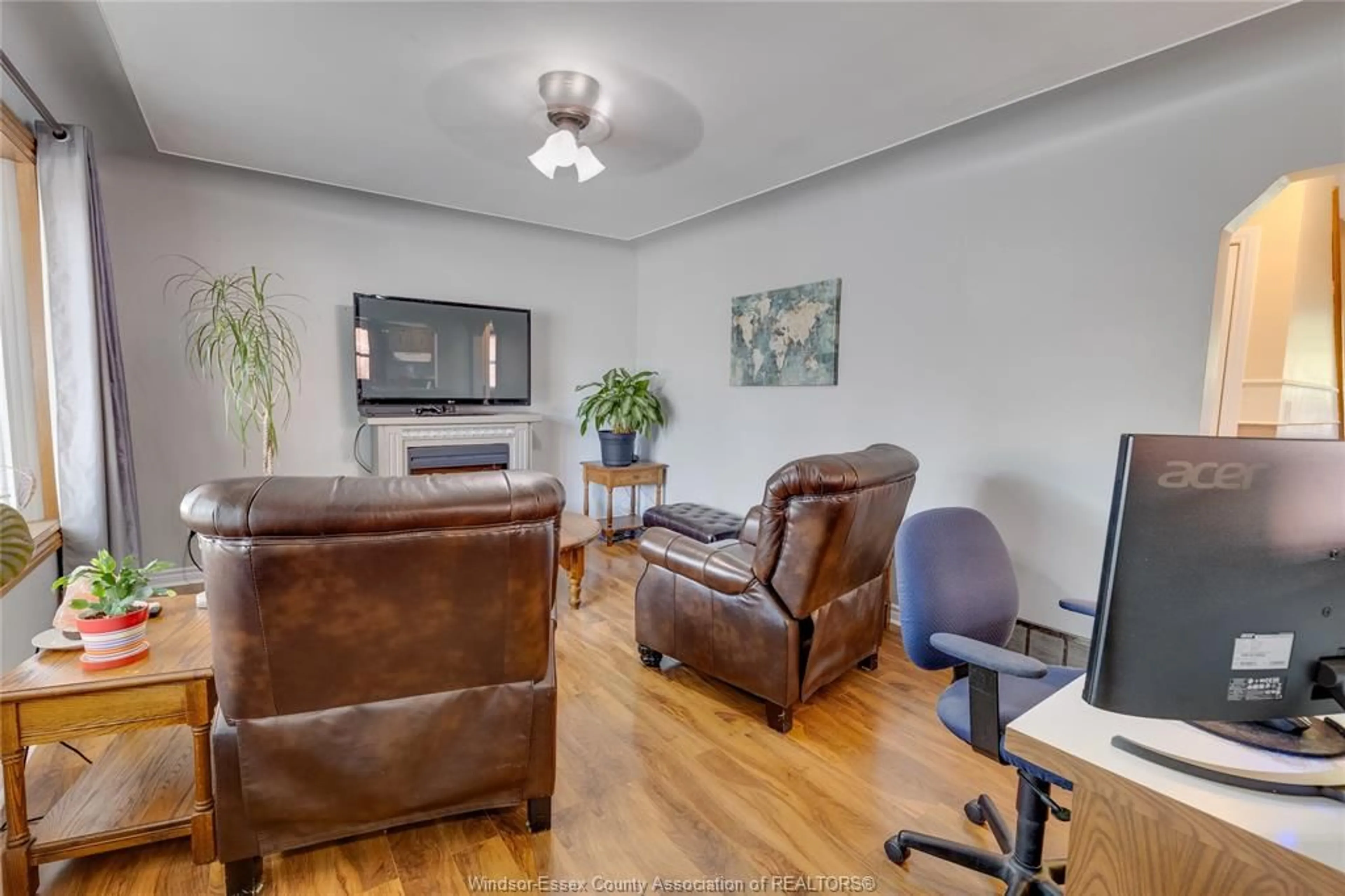 Living room with furniture, wood/laminate floor for 1075 PRADO Pl, Windsor Ontario N8S 2H6