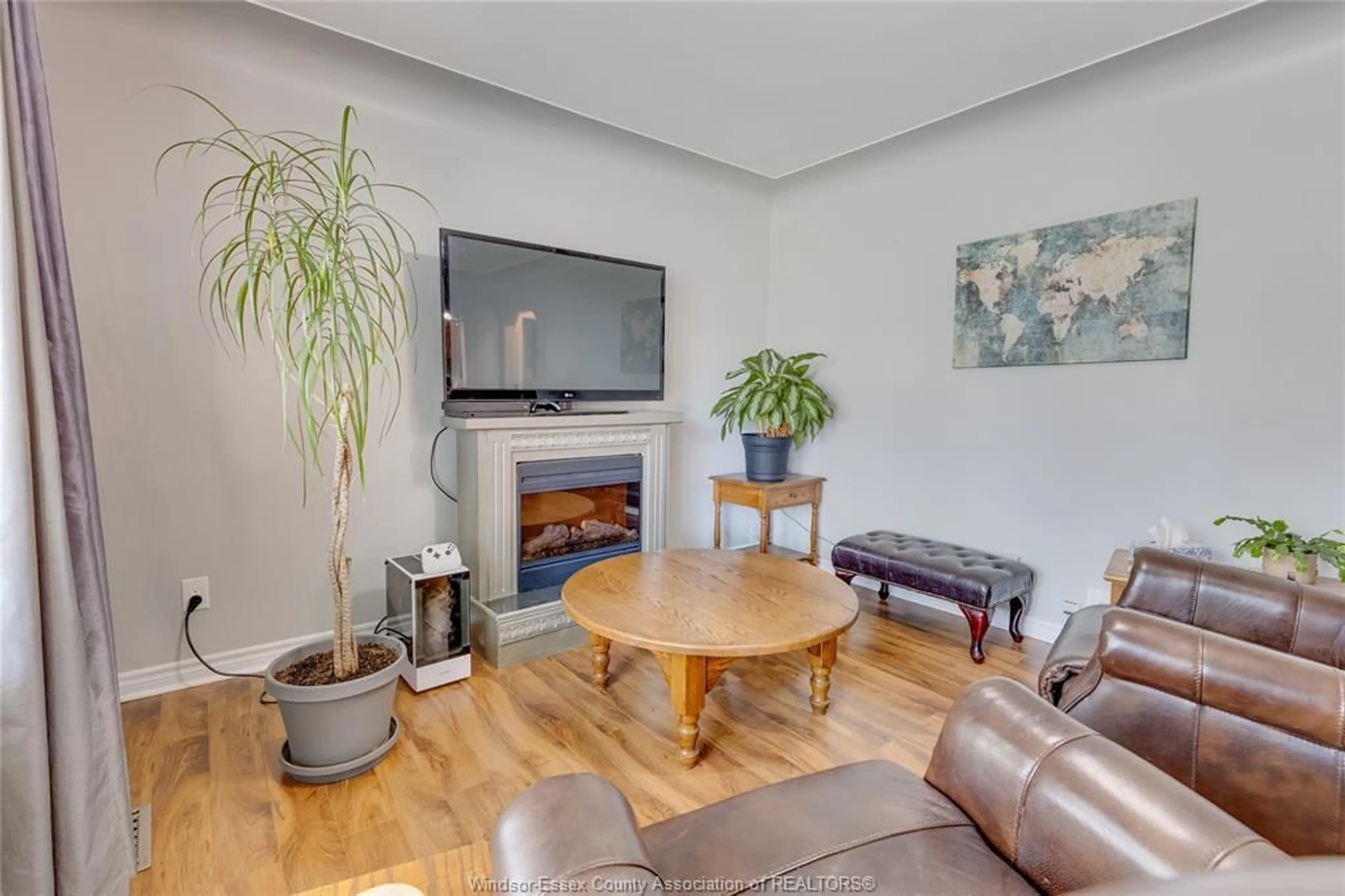 Living room with furniture, wood/laminate floor for 1075 PRADO Pl, Windsor Ontario N8S 2H6