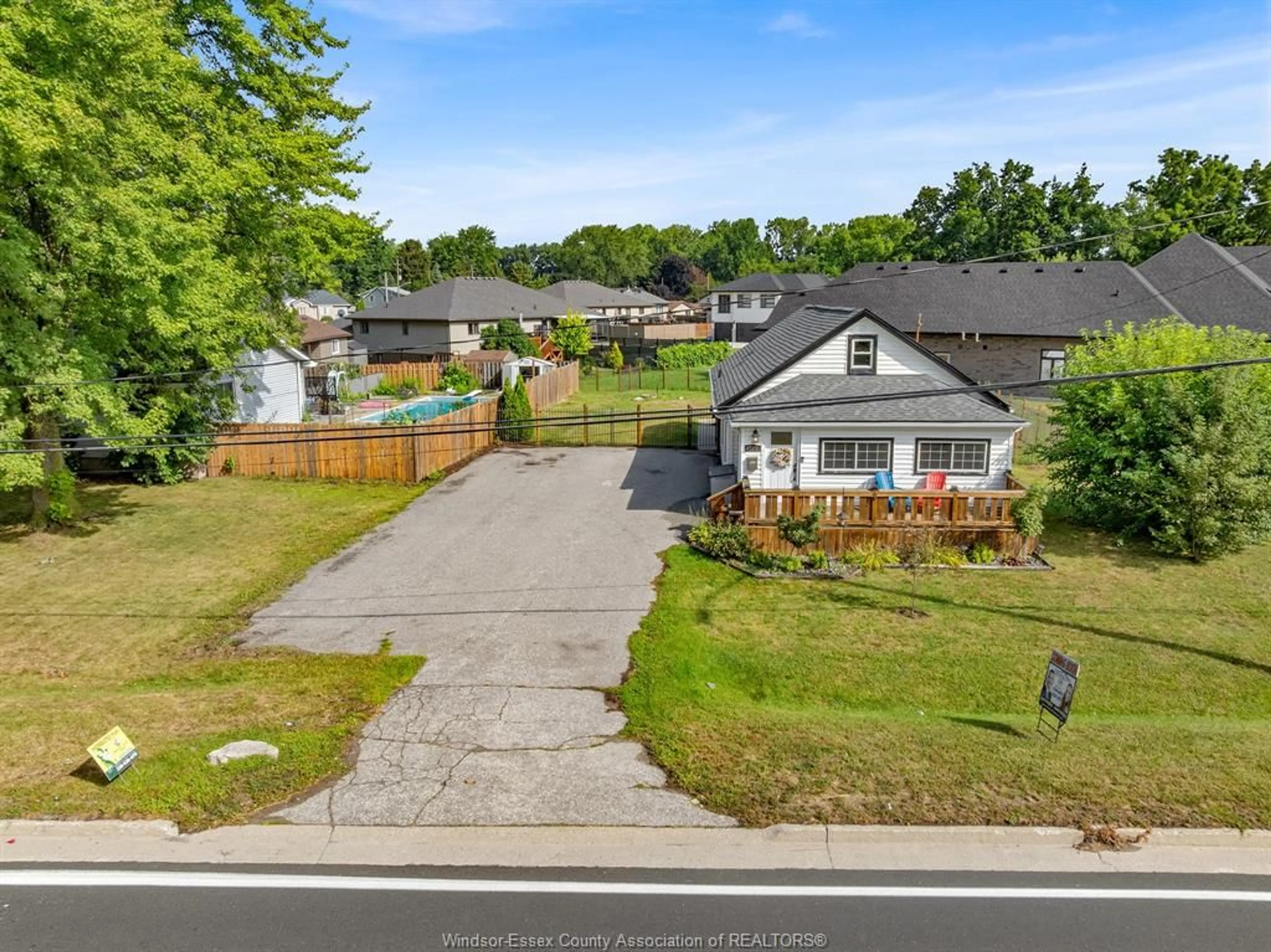 A pic from outside/outdoor area/front of a property/back of a property/a pic from drone, street for 310 HIGHWAY 18, LaSalle Ontario N9J 1Z7