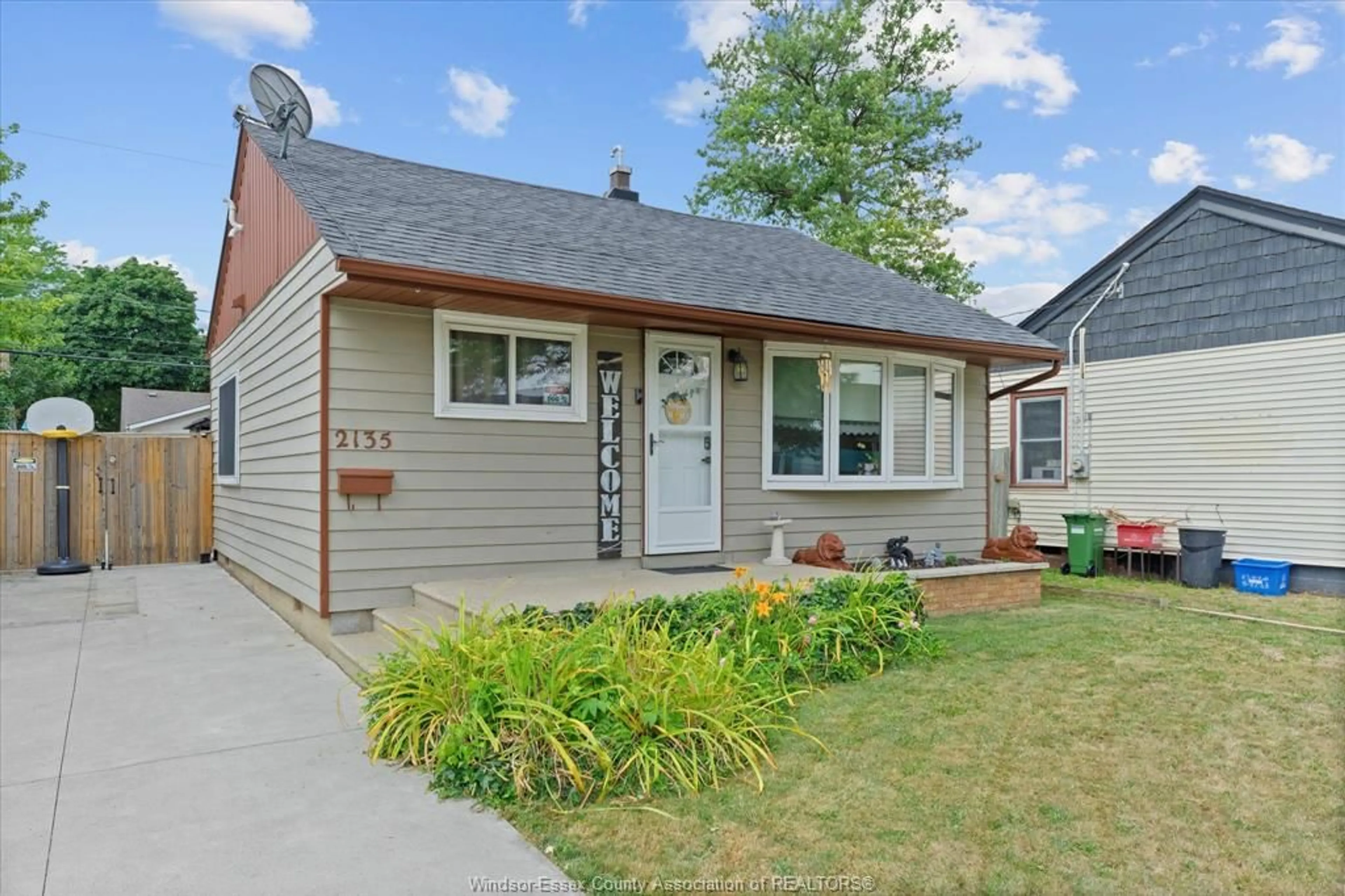 Home with vinyl exterior material, street for 2135 FOREST Ave, Windsor Ontario N8W 2G4