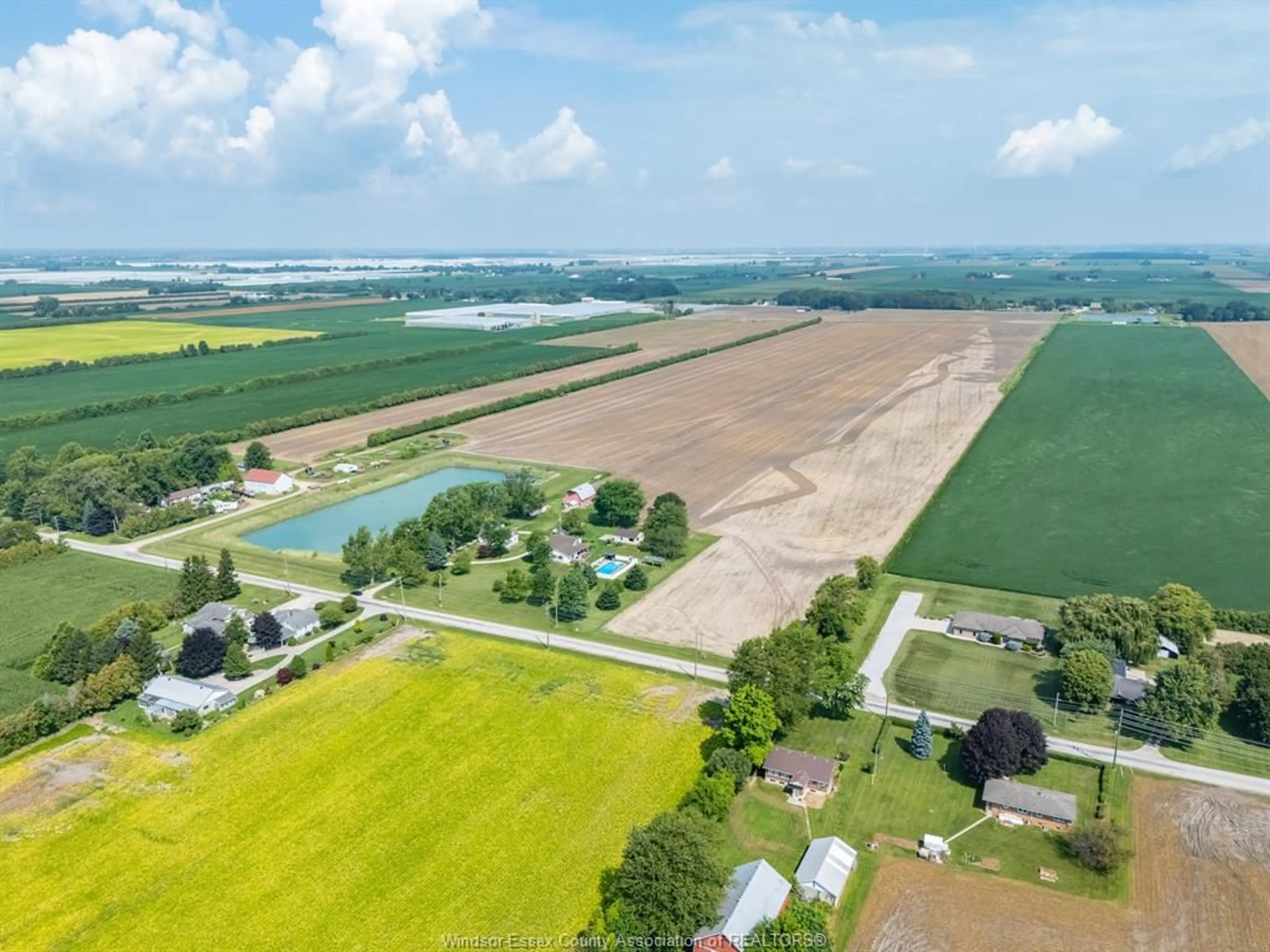 A pic from outside/outdoor area/front of a property/back of a property/a pic from drone, water/lake/river/ocean view for 1105 Mersea Road 6 ..., Leamington Ontario N8H 3V8