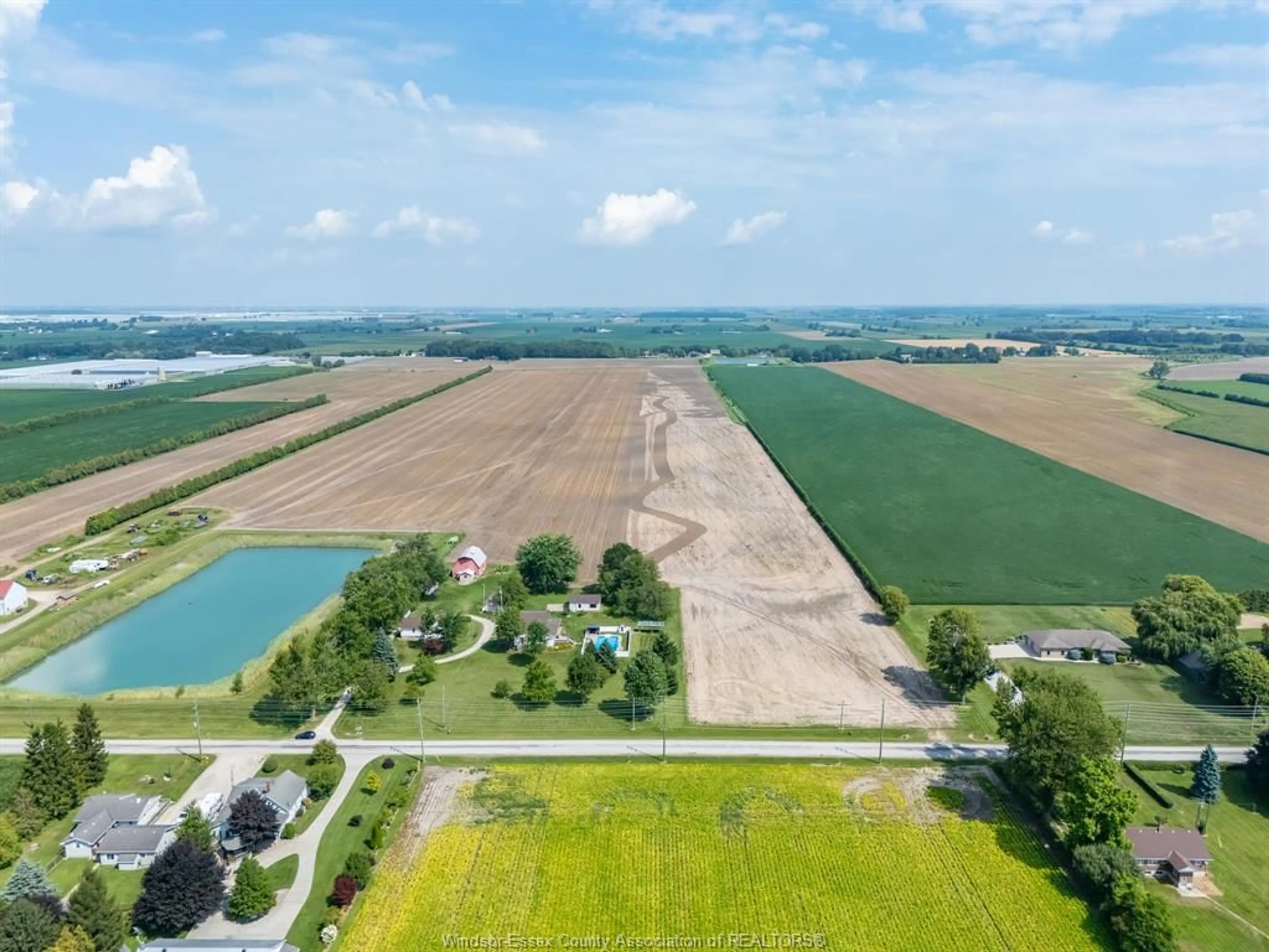 A pic from outside/outdoor area/front of a property/back of a property/a pic from drone, water/lake/river/ocean view for 1105 Mersea Road 6 ..., Leamington Ontario N8H 3V8