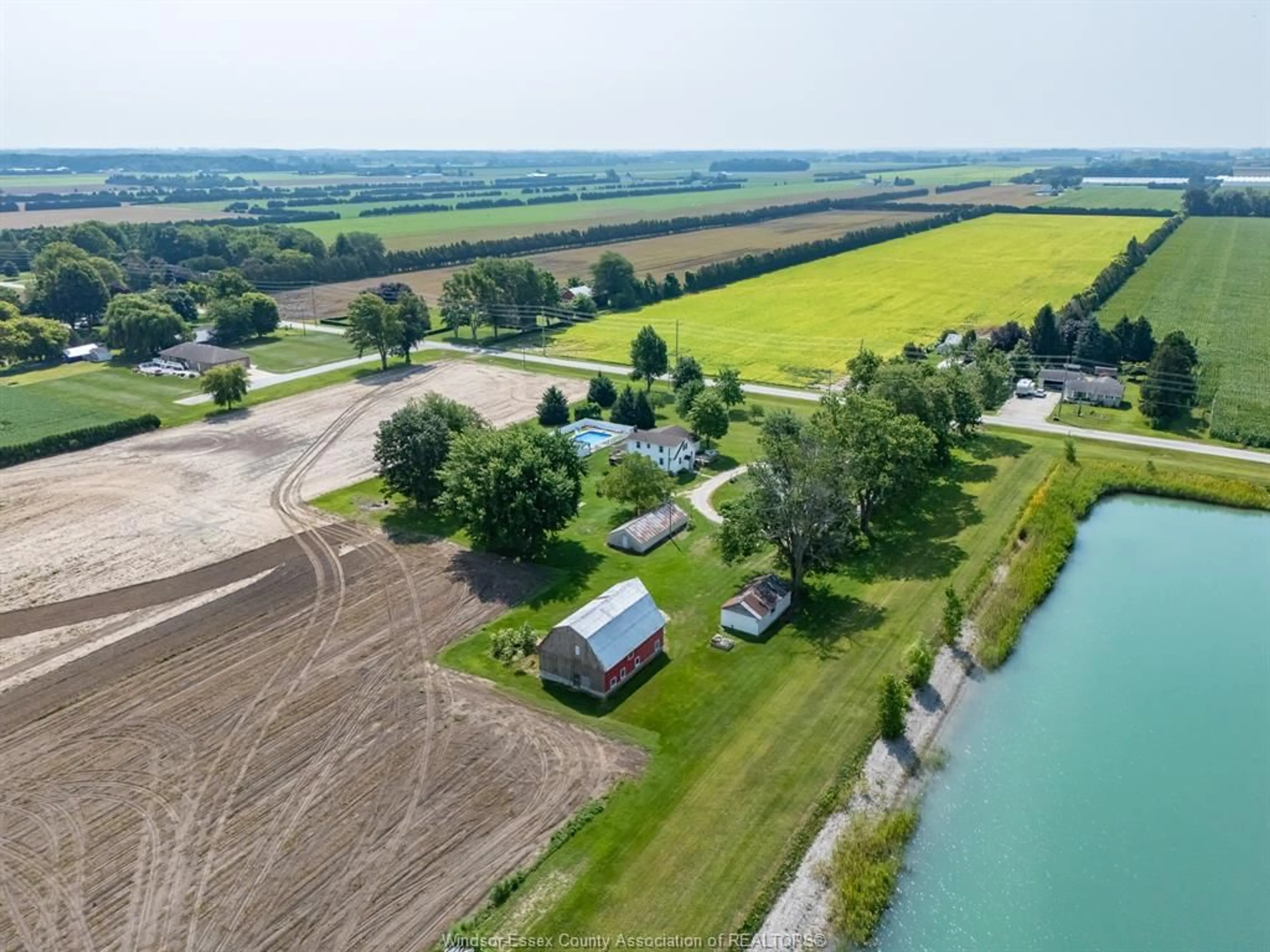 A pic from outside/outdoor area/front of a property/back of a property/a pic from drone, water/lake/river/ocean view for 1105 Mersea Road 6 ..., Leamington Ontario N8H 3V8