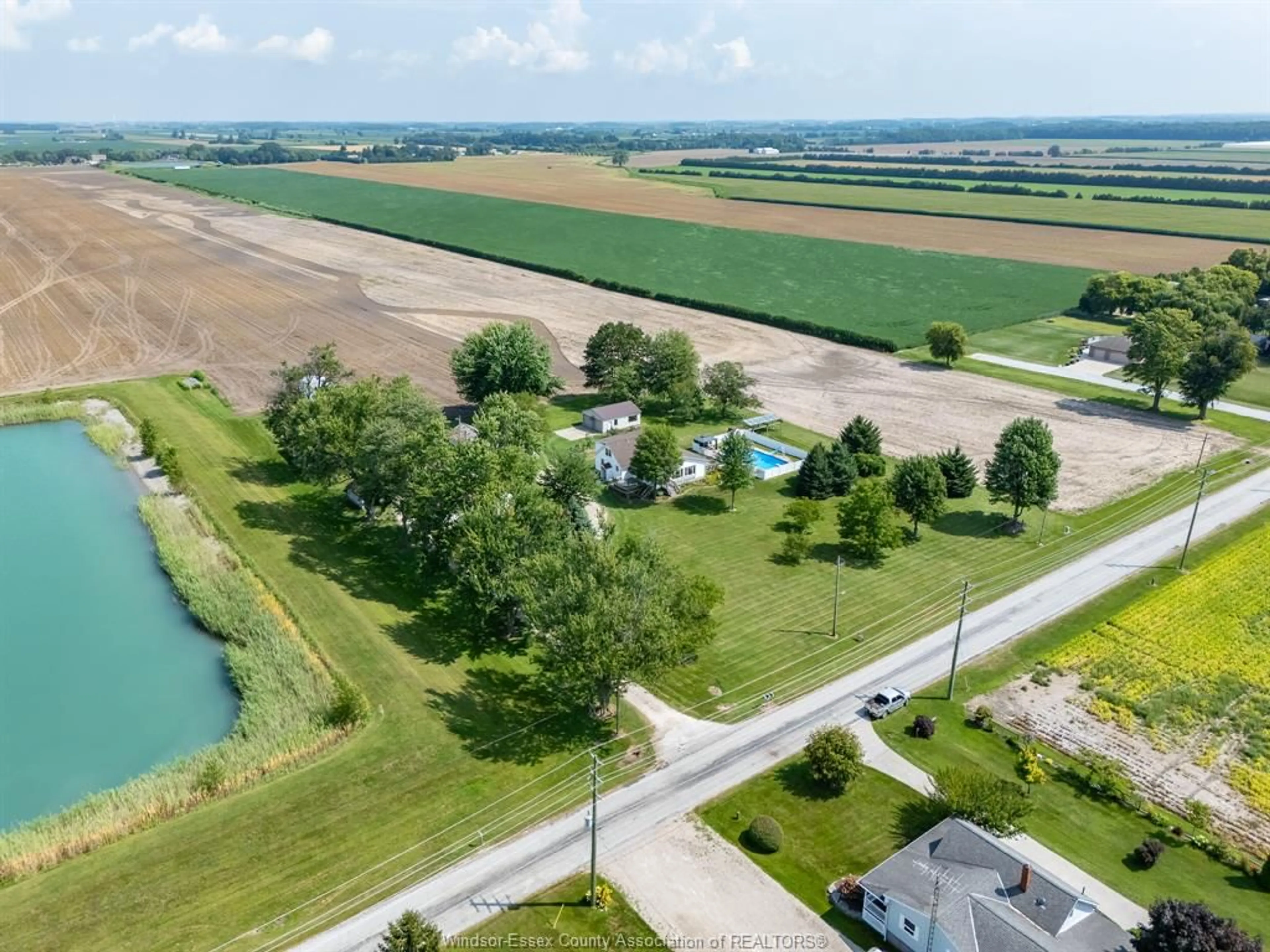 A pic from outside/outdoor area/front of a property/back of a property/a pic from drone, water/lake/river/ocean view for 1105 Mersea Road 6 ..., Leamington Ontario N8H 3V8