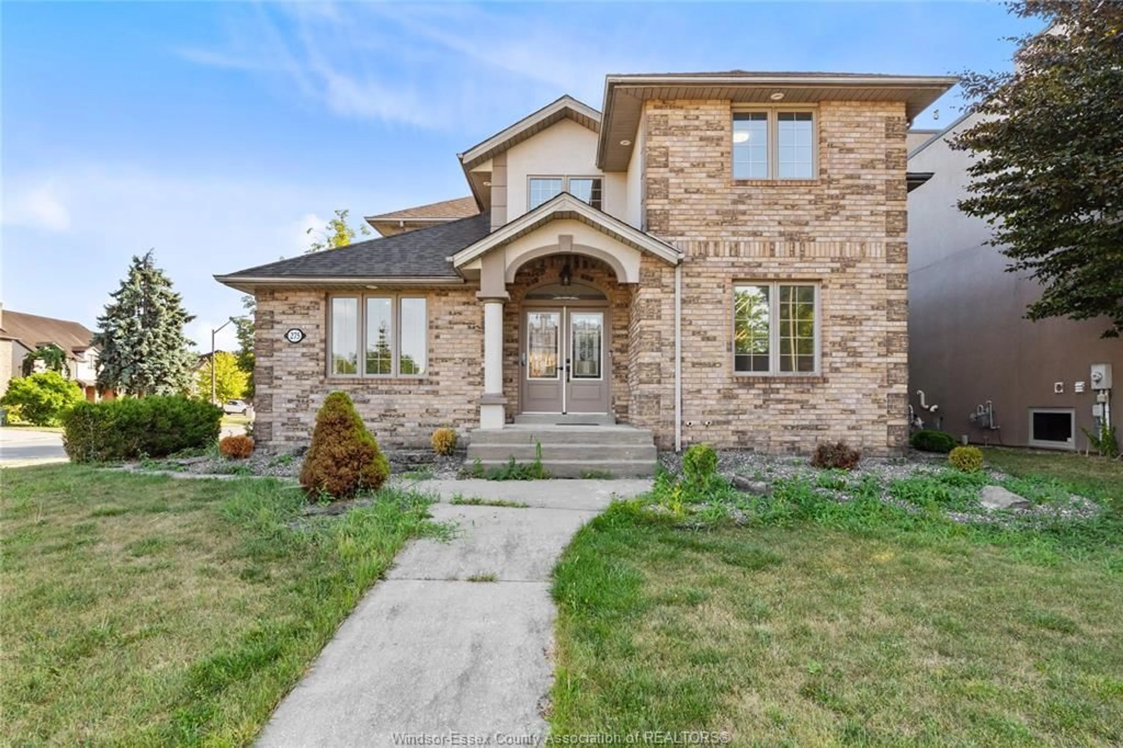 Home with brick exterior material, street for 275 RUSSELL WOODS Dr, Lakeshore Ontario N8N 4K4