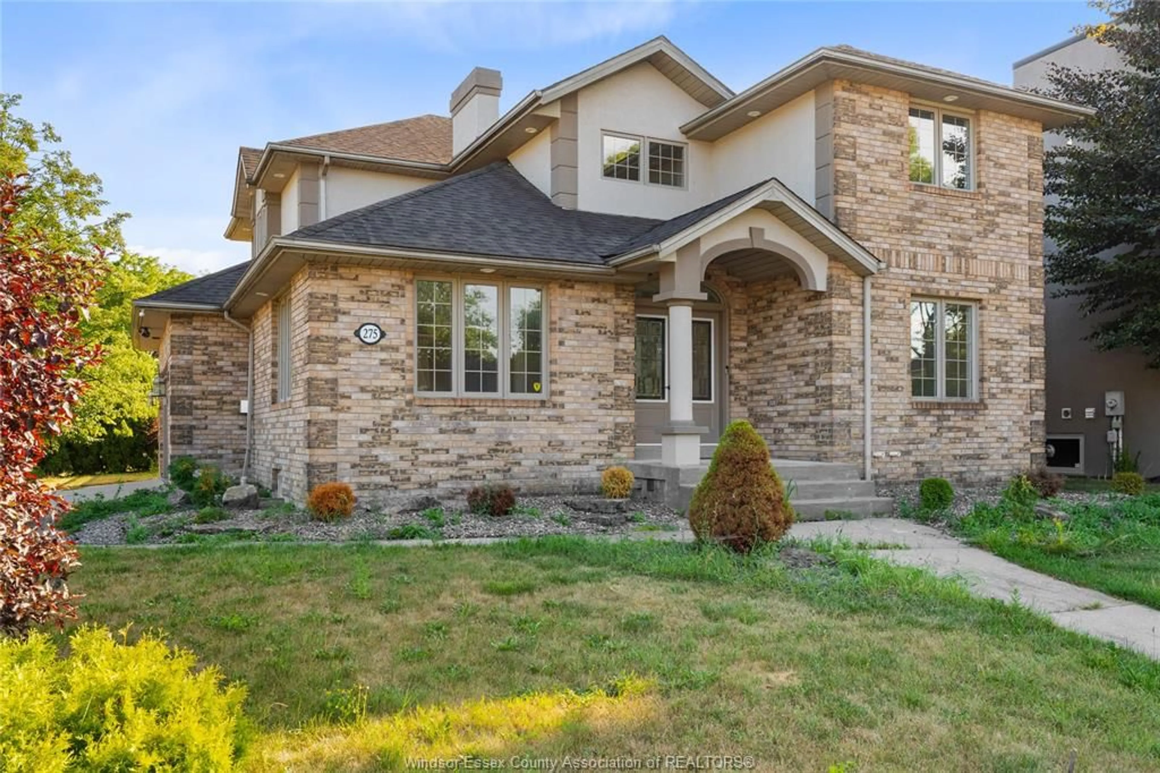 Home with brick exterior material, street for 275 RUSSELL WOODS Dr, Lakeshore Ontario N8N 4K4