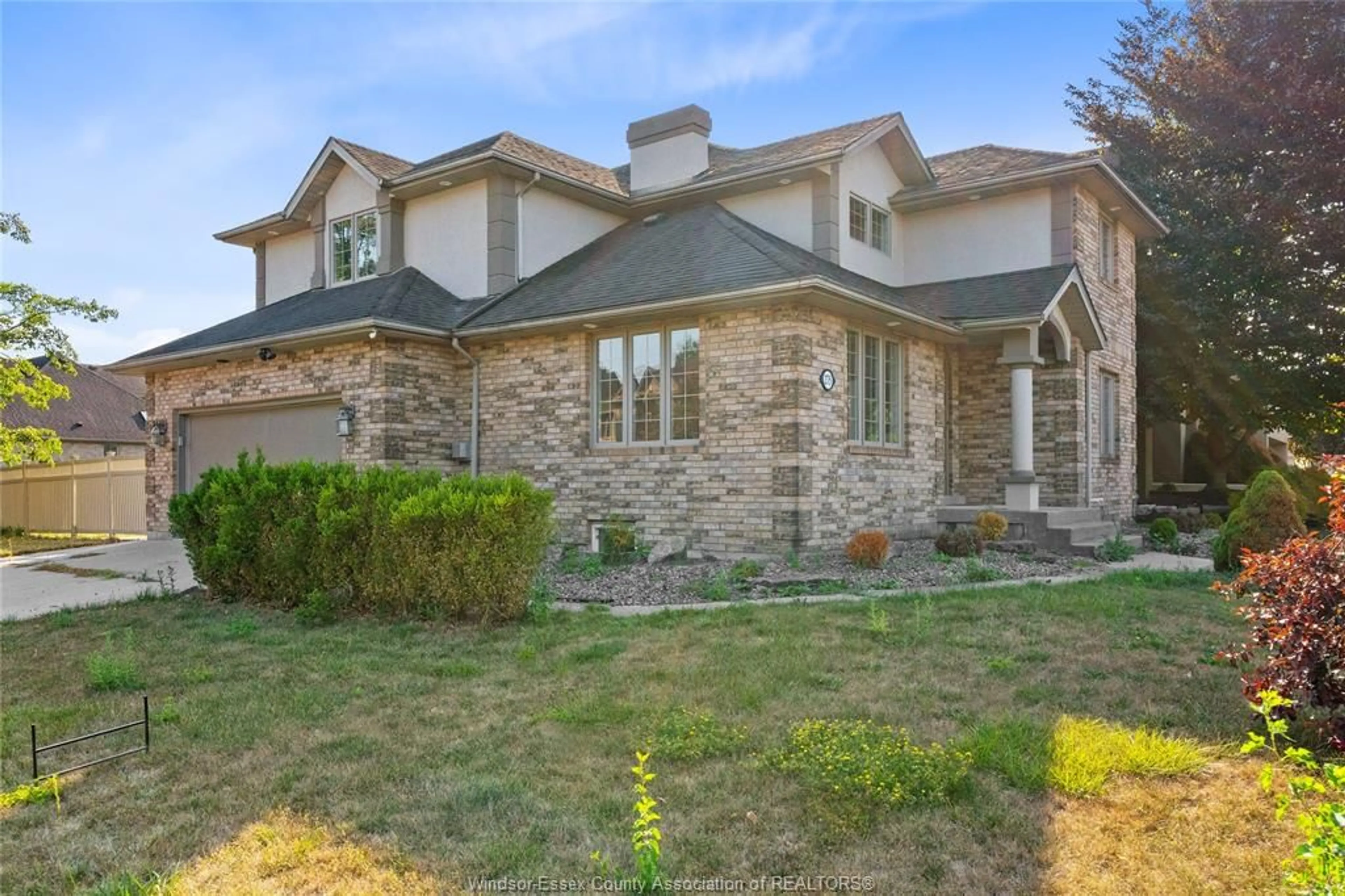 Home with brick exterior material, street for 275 RUSSELL WOODS Dr, Lakeshore Ontario N8N 4K4