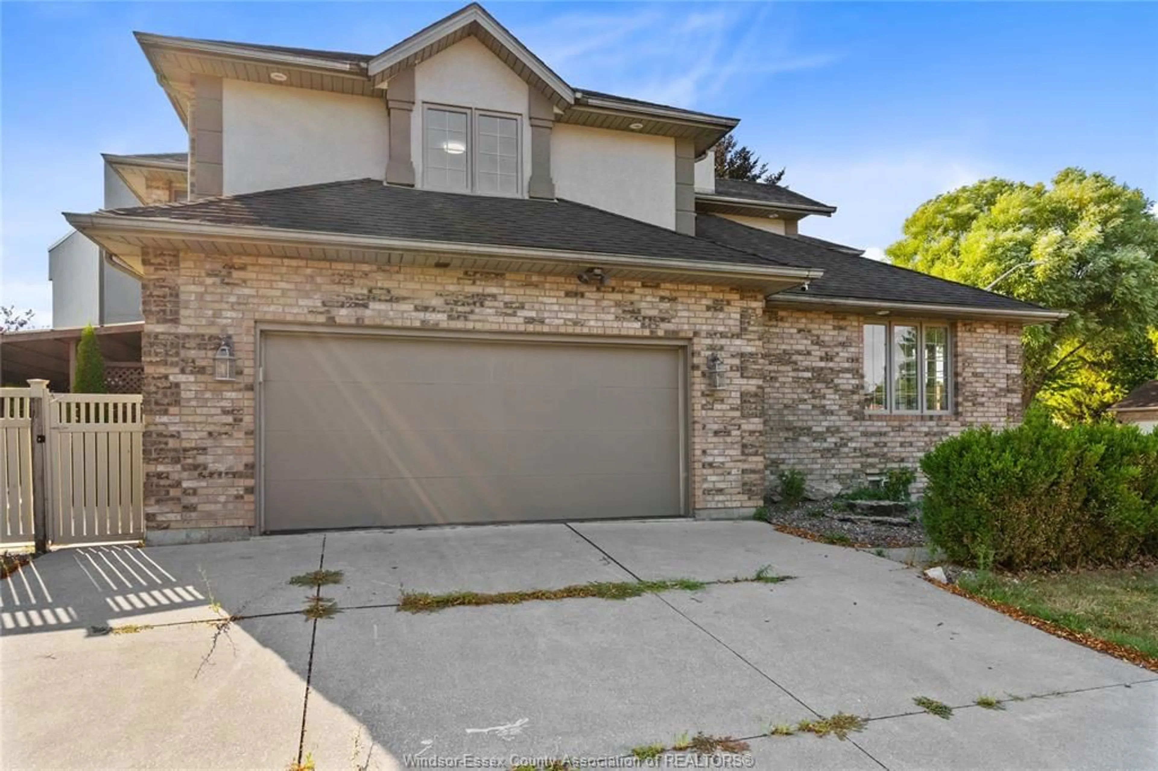Home with brick exterior material, street for 275 RUSSELL WOODS Dr, Lakeshore Ontario N8N 4K4