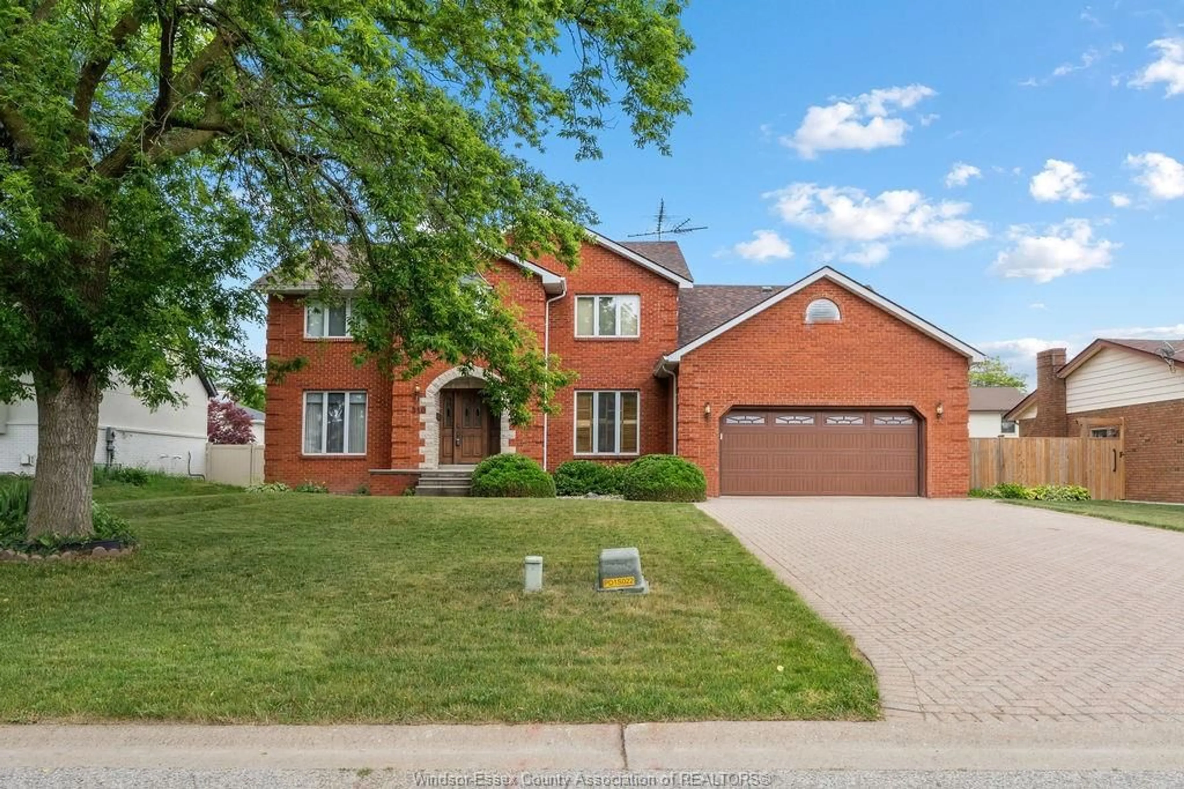 Home with brick exterior material, street for 510 HARBOURNE Cres, Tecumseh Ontario N8N 3J2