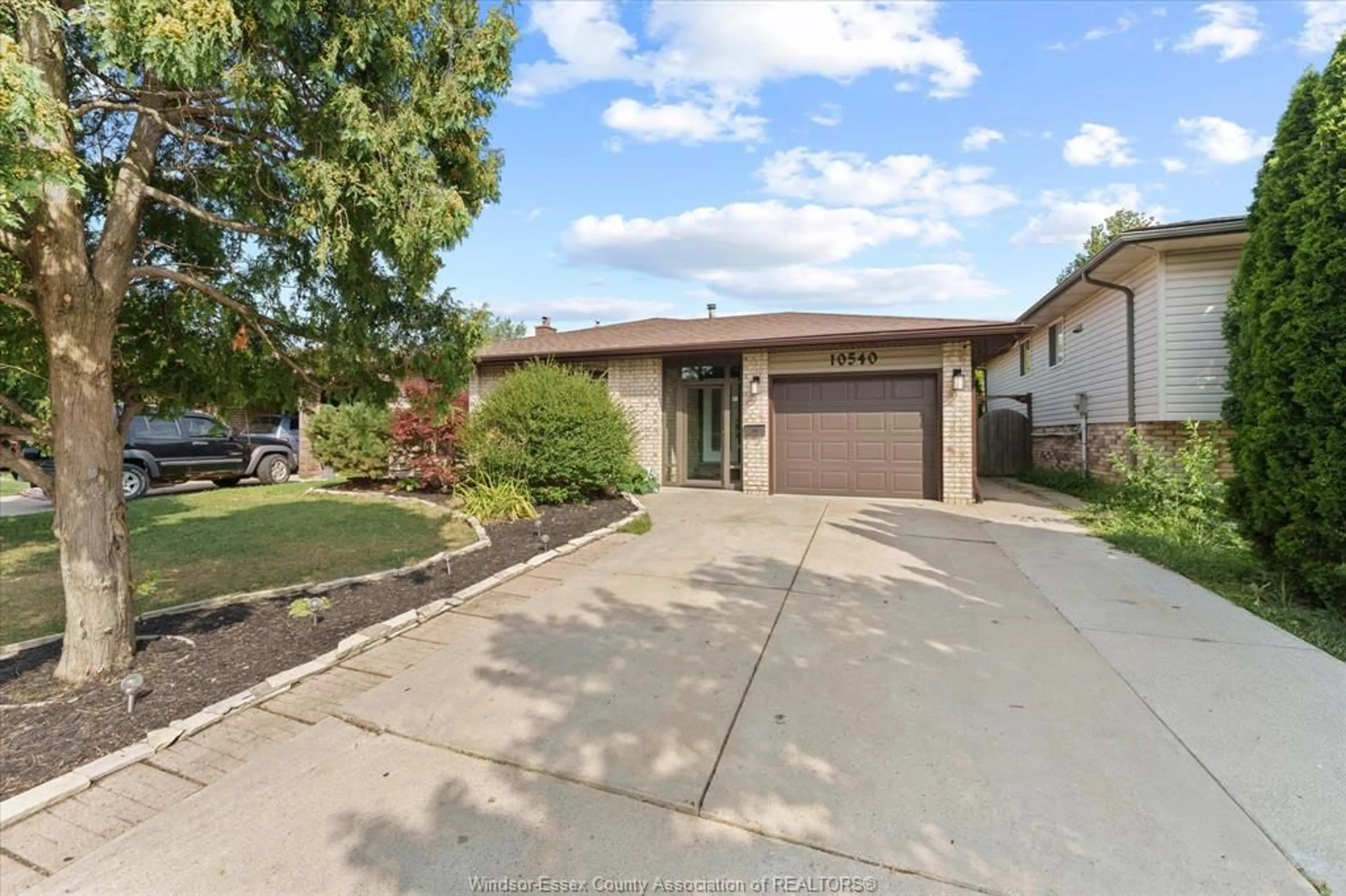 A pic from outside/outdoor area/front of a property/back of a property/a pic from drone, street for 10540 Halstead Cres, Windsor Ontario N8R 2C4
