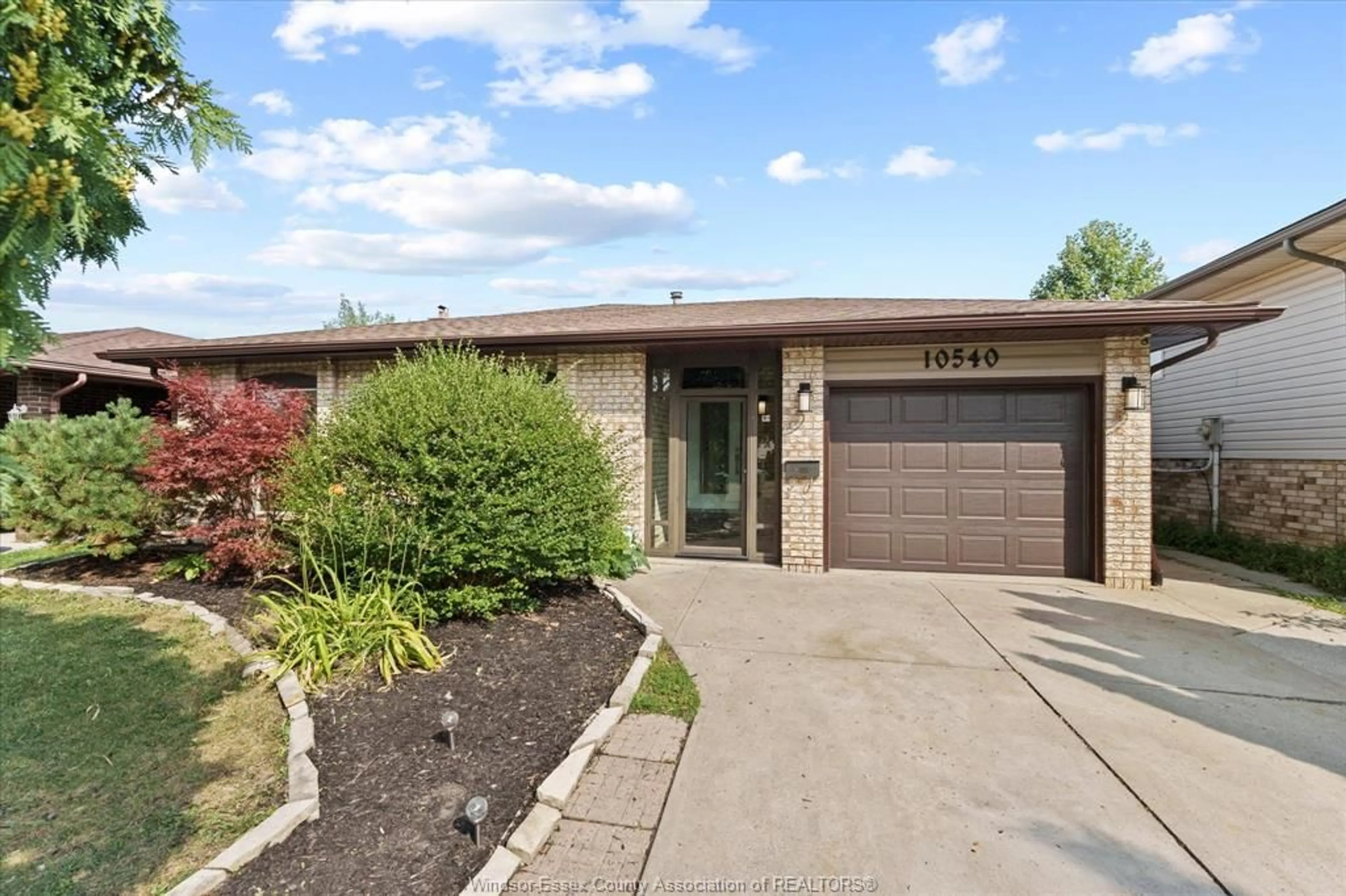 Home with brick exterior material, street for 10540 Halstead Cres, Windsor Ontario N8R 2C4