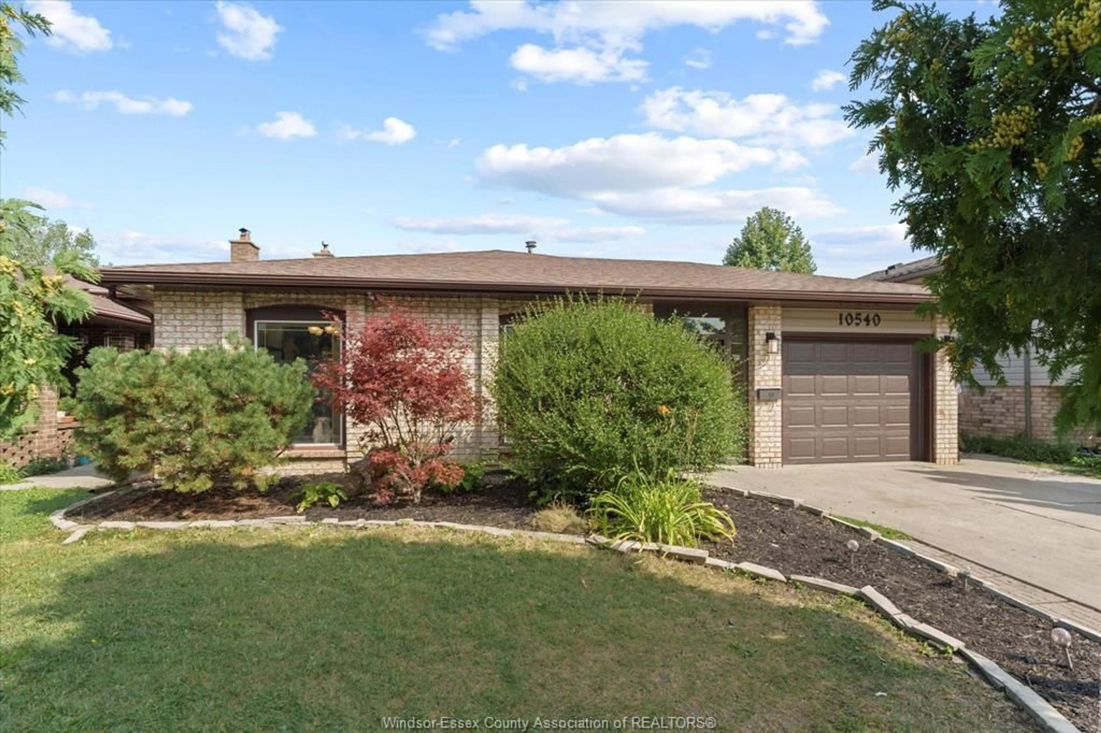 Home with brick exterior material, street for 10540 Halstead Cres, Windsor Ontario N8R 2C4