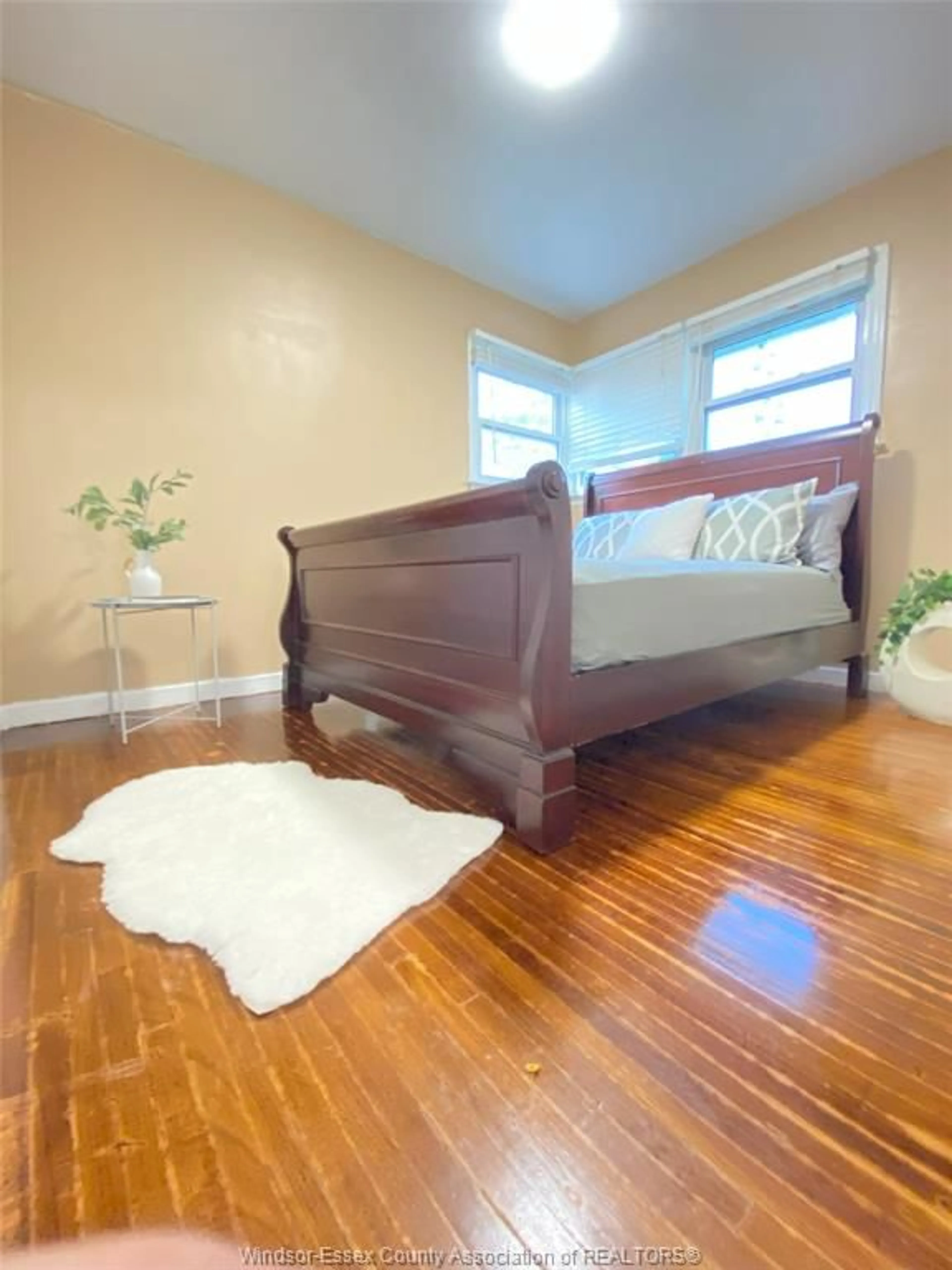 Bedroom with bed, wood/laminate floor for 3672 MORRIS Dr, Windsor Ontario N9E 2K7