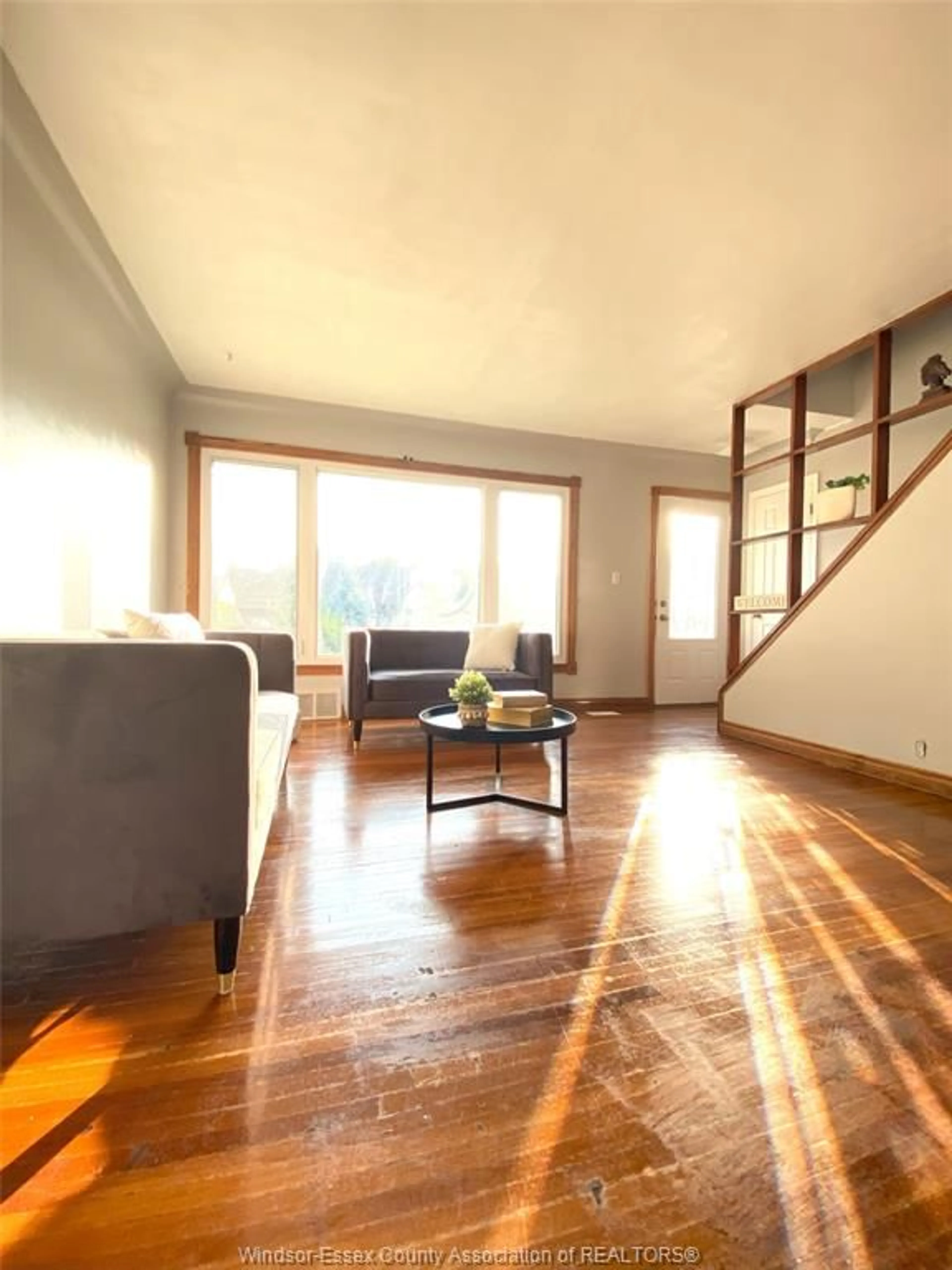 Living room with furniture, wood/laminate floor for 3672 MORRIS Dr, Windsor Ontario N9E 2K7