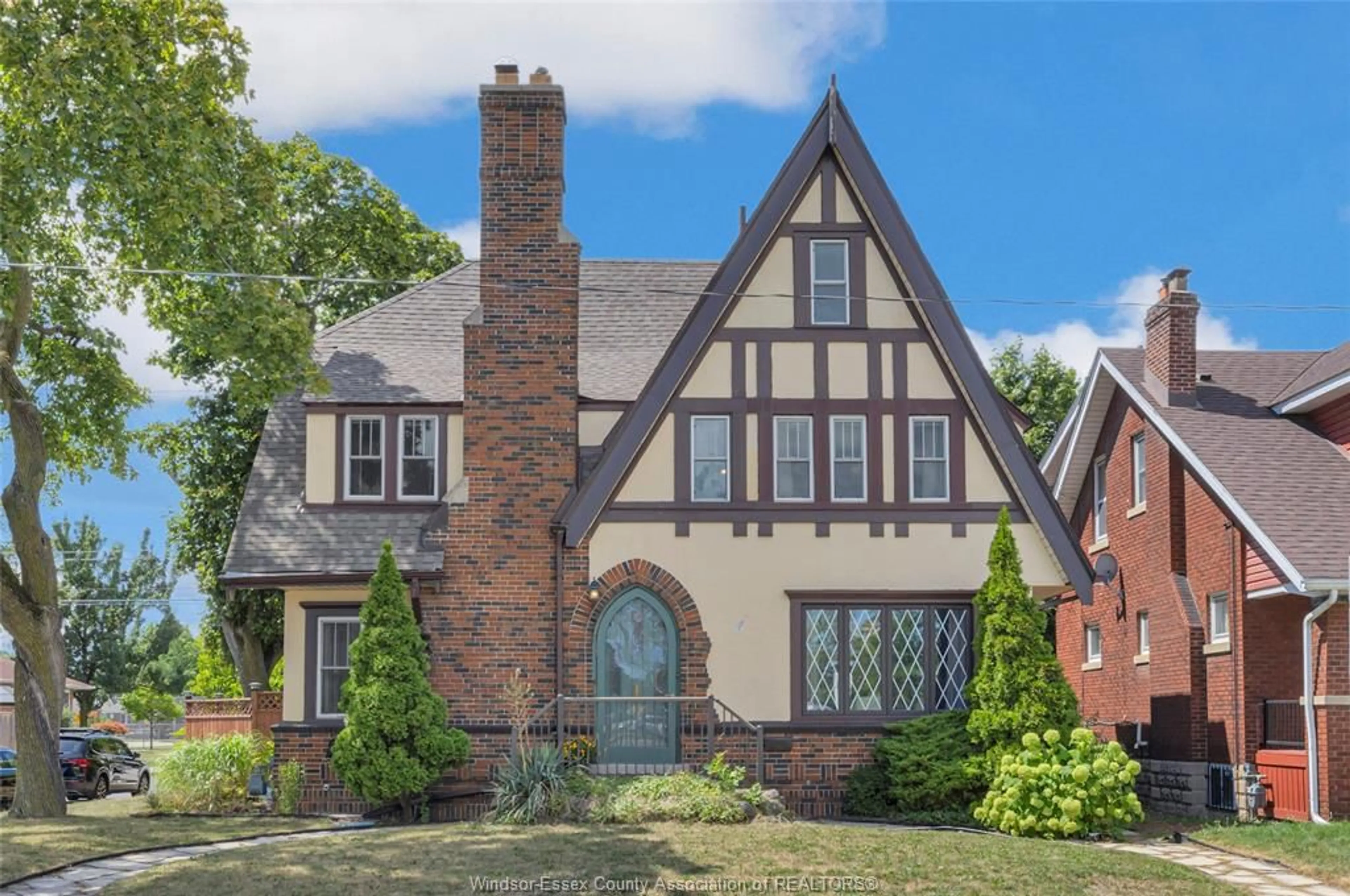 Home with brick exterior material, street for 2195 Kildare Rd, Windsor Ontario N8W 2W9