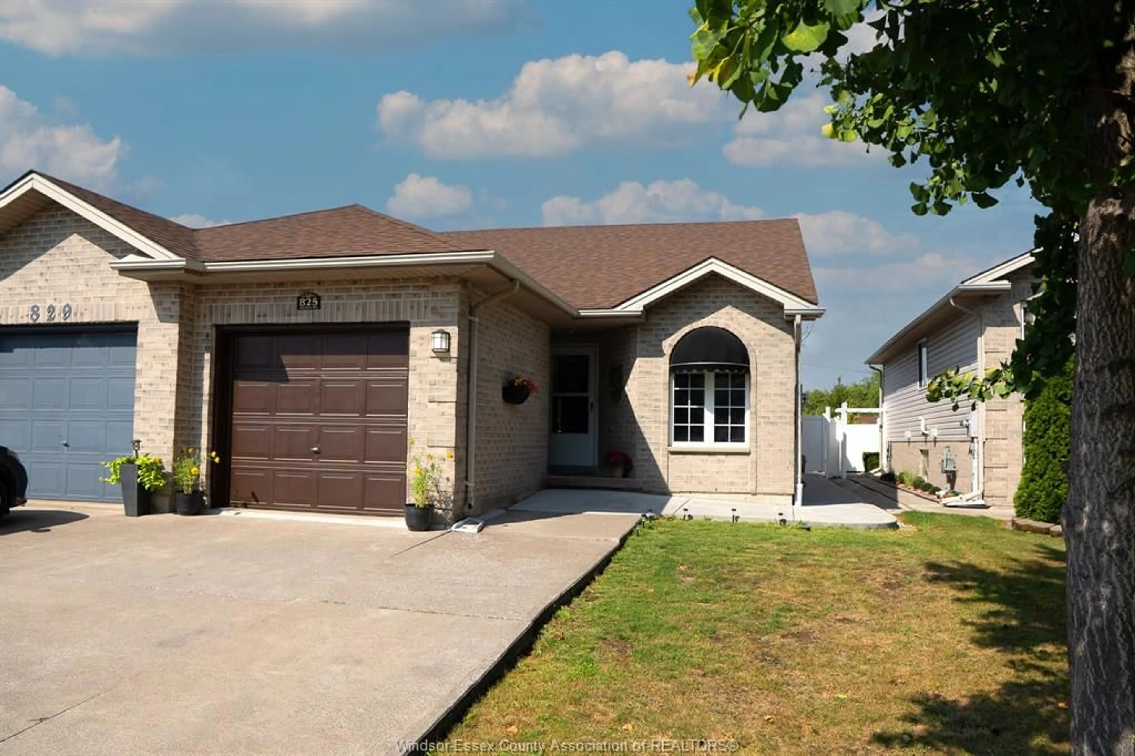 Home with brick exterior material, street for 825 MICHAEL Dr, Tecumseh Ontario N8N 5A2