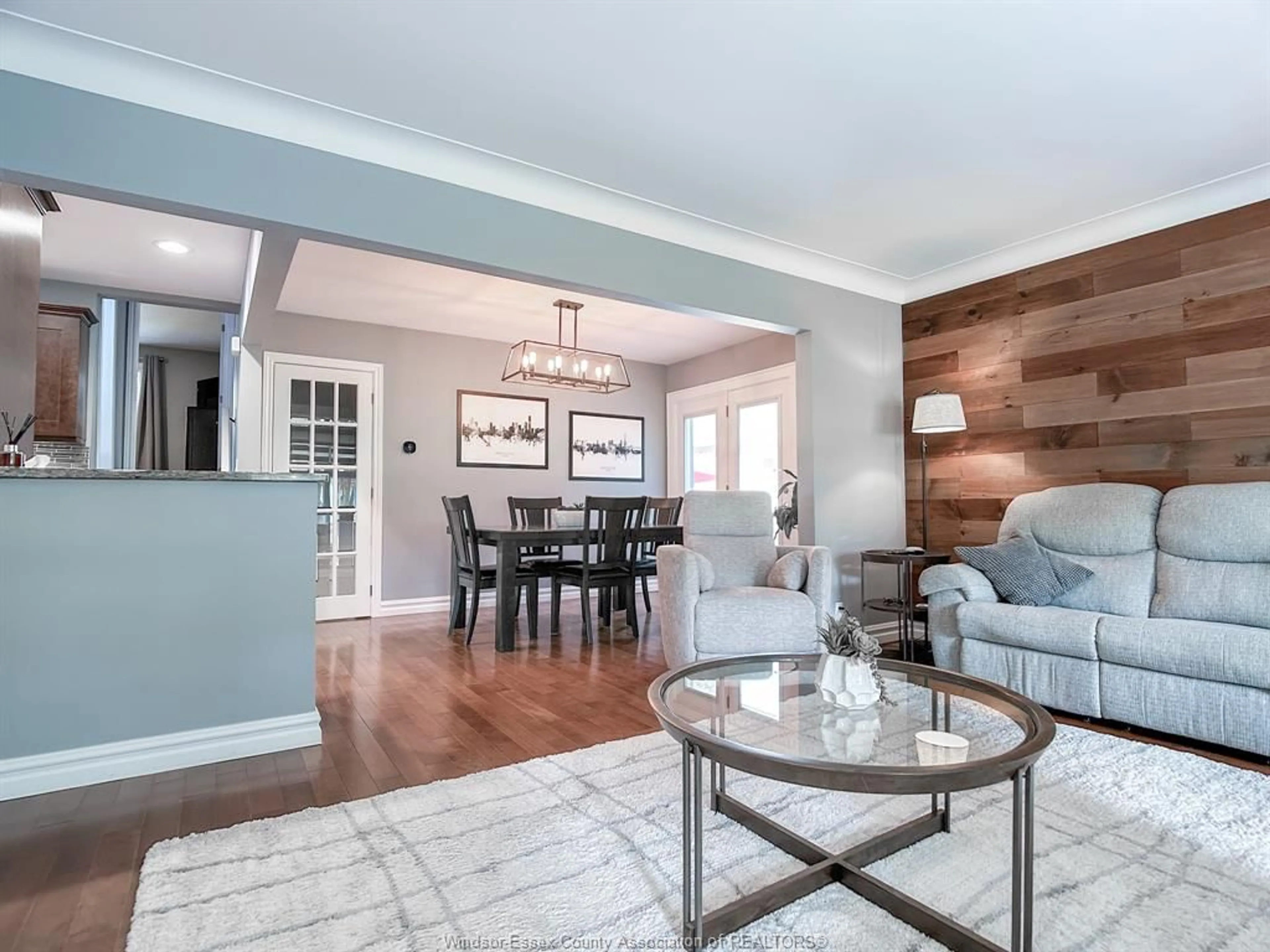 Living room with furniture, wood/laminate floor for 157 KENSINGTON Blvd, Tecumseh Ontario N8N 2K7