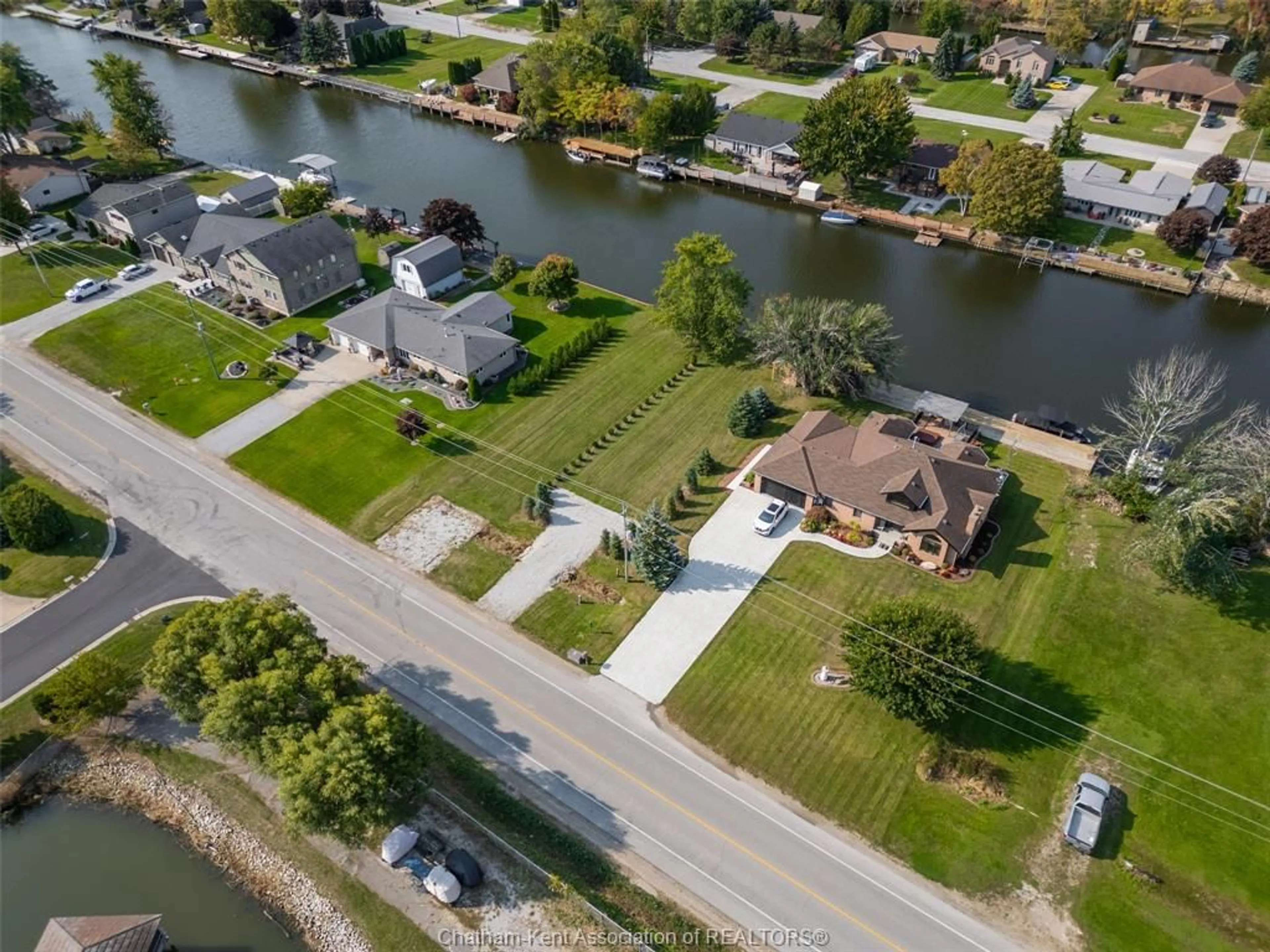 A pic from outside/outdoor area/front of a property/back of a property/a pic from drone, water/lake/river/ocean view for 705 Tisdelle Dr, Lakeshore Ontario N0P 2L0