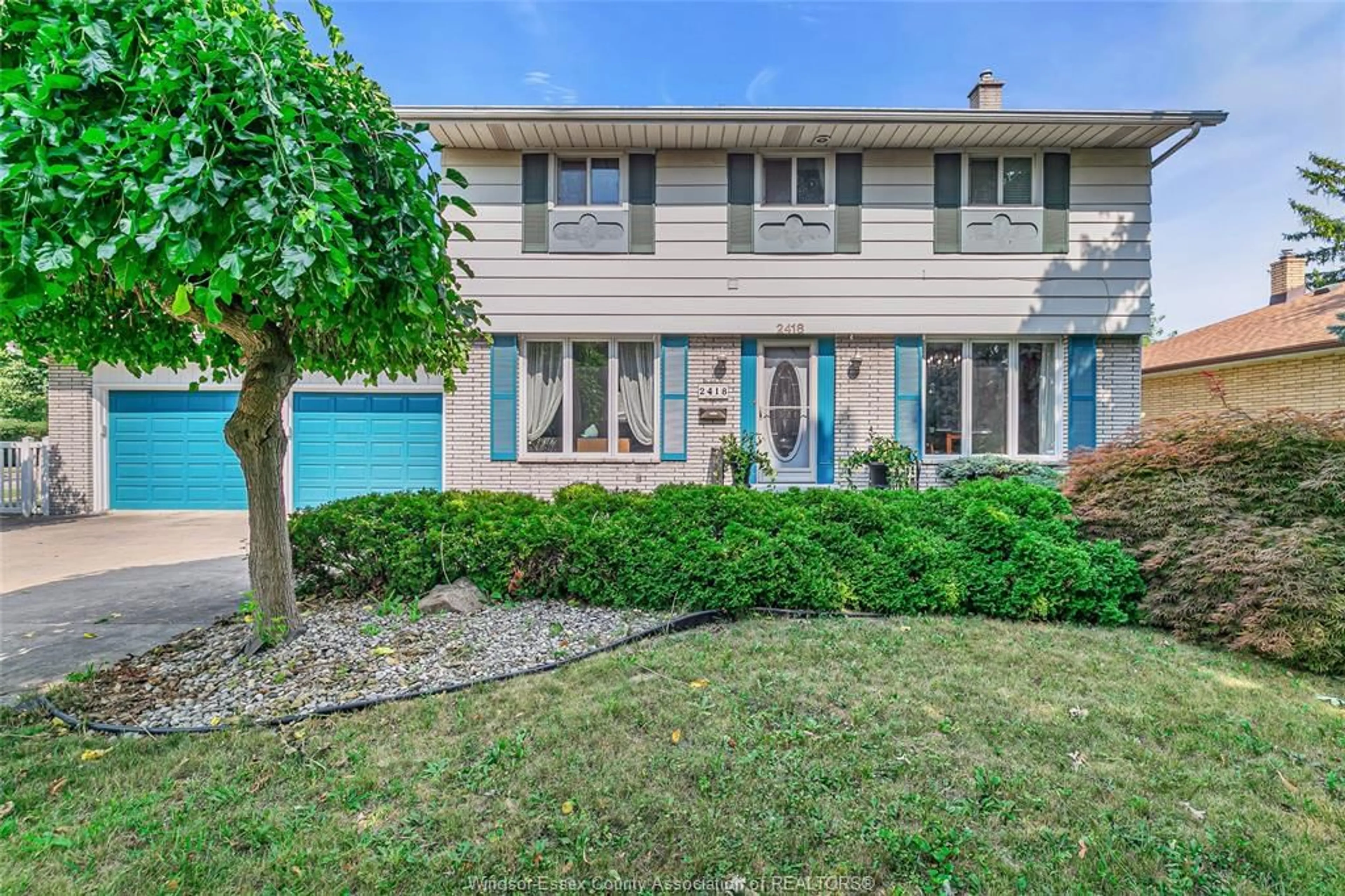 Home with vinyl exterior material, street for 2418 MARK Ave, Windsor Ontario N9E 2W3
