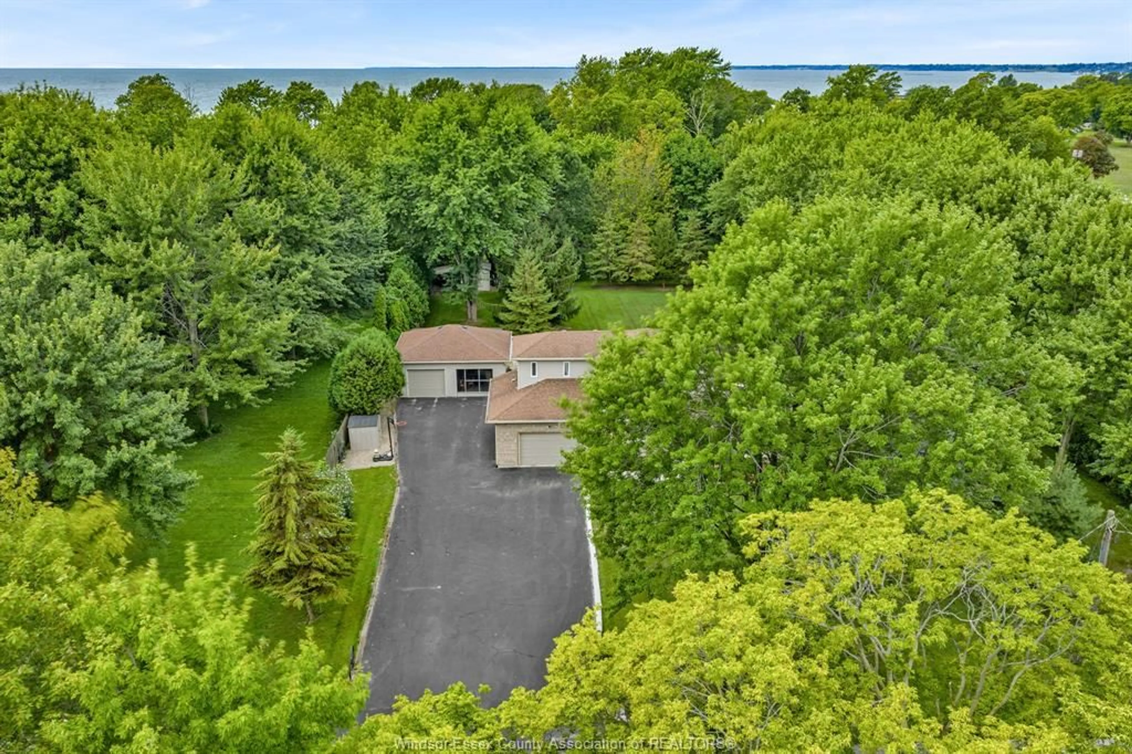 A pic from outside/outdoor area/front of a property/back of a property/a pic from drone, water/lake/river/ocean view for 9 ELLIS Rd, Leamington Ontario N8H 3V4