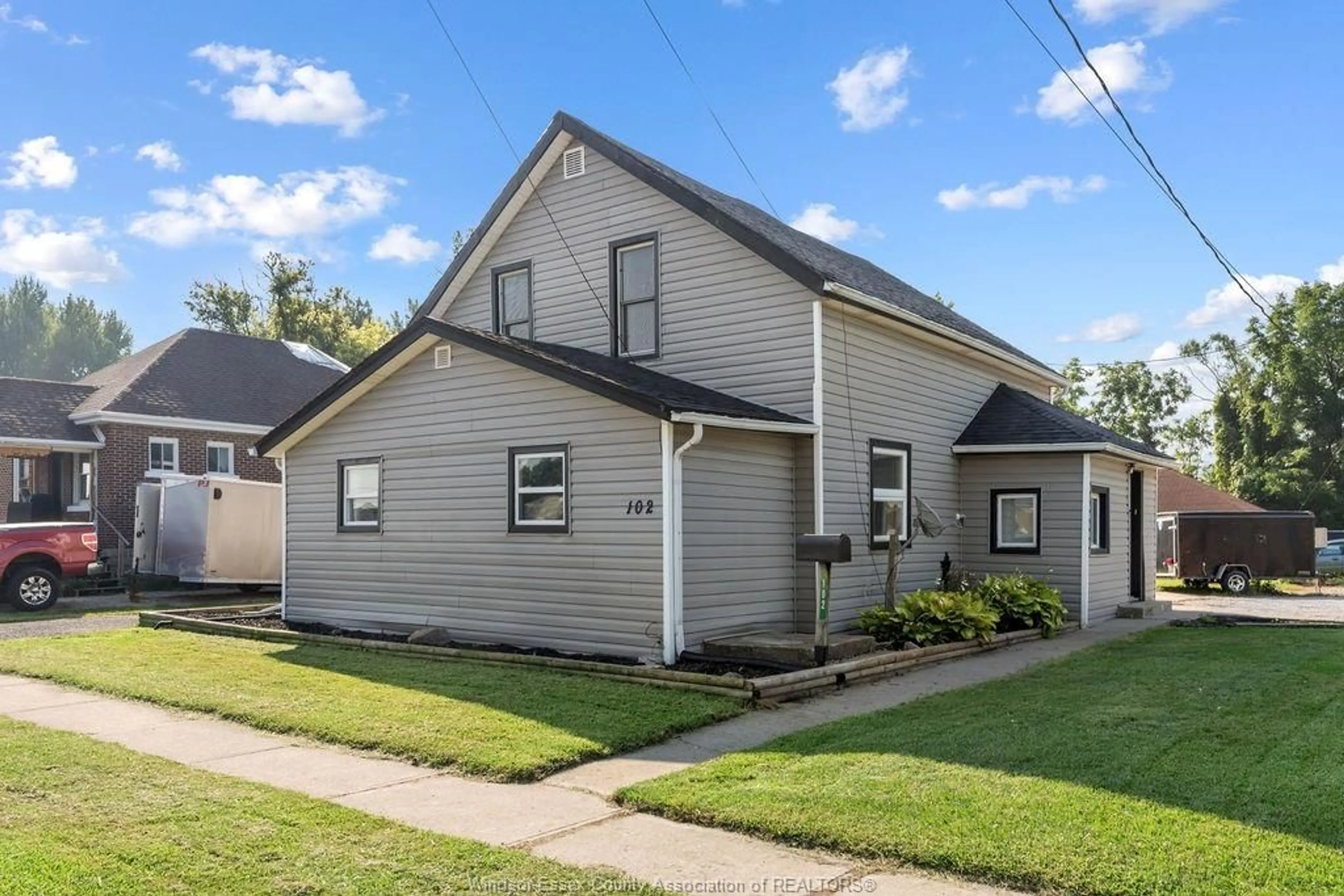 Home with vinyl exterior material, street for 102 CAMERON, Essex Ontario N8M 2L5