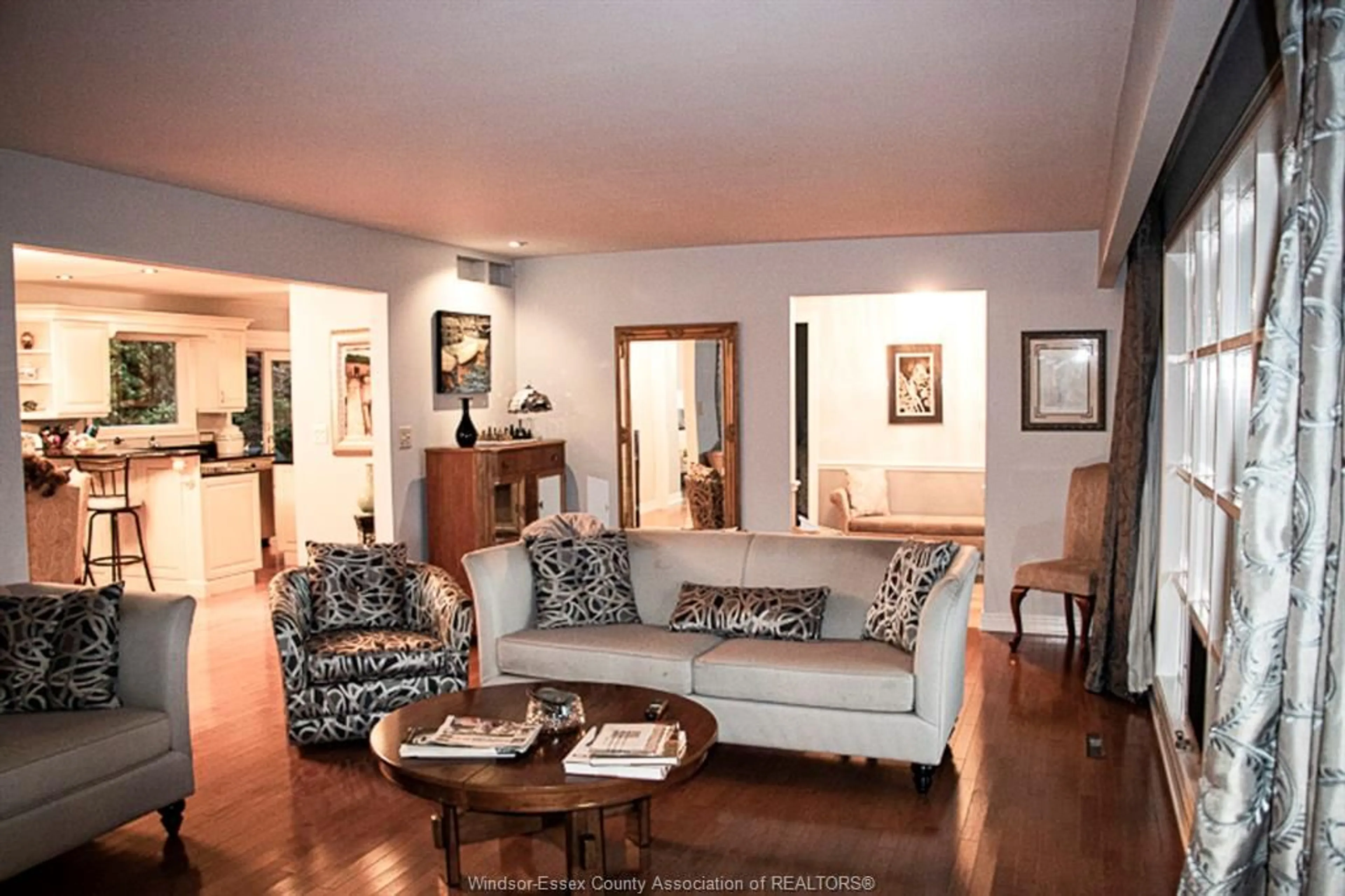 Living room with furniture, wood/laminate floor for 3068 CENTENNIAL Cres, Kingsville Ontario N8H 4G5