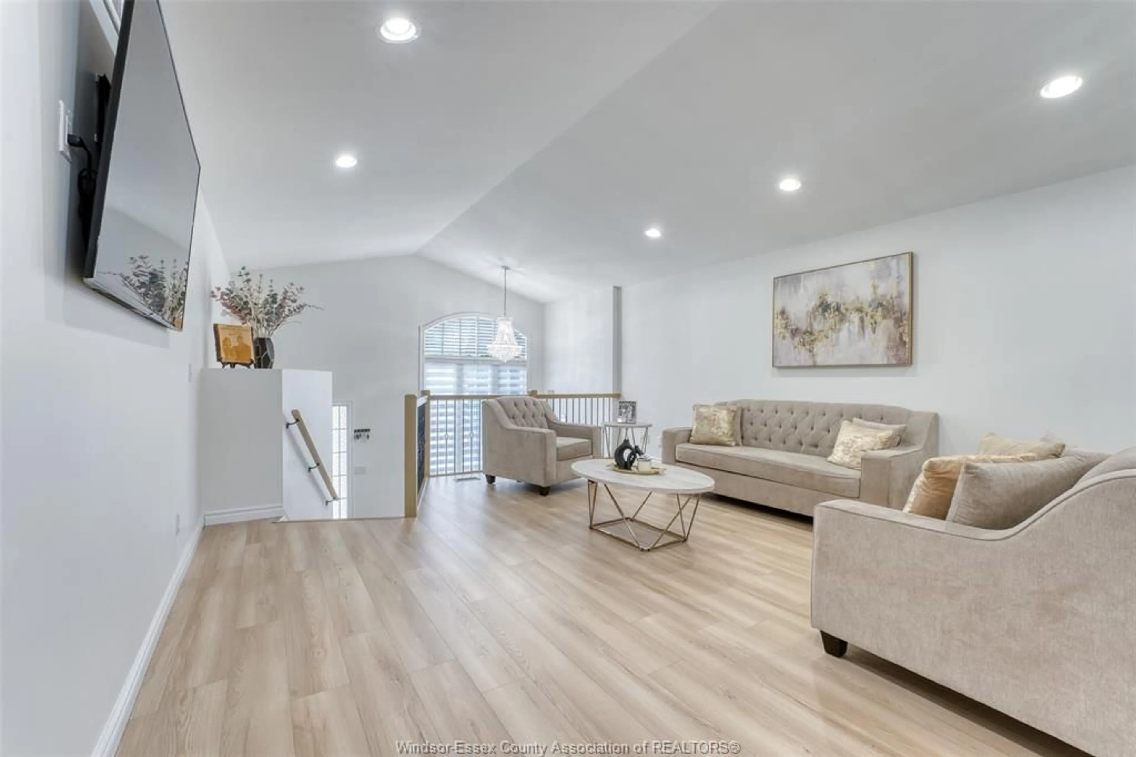 Living room with furniture, wood/laminate floor for 4652 HELSINKI Cres, Windsor Ontario N9G 3G2
