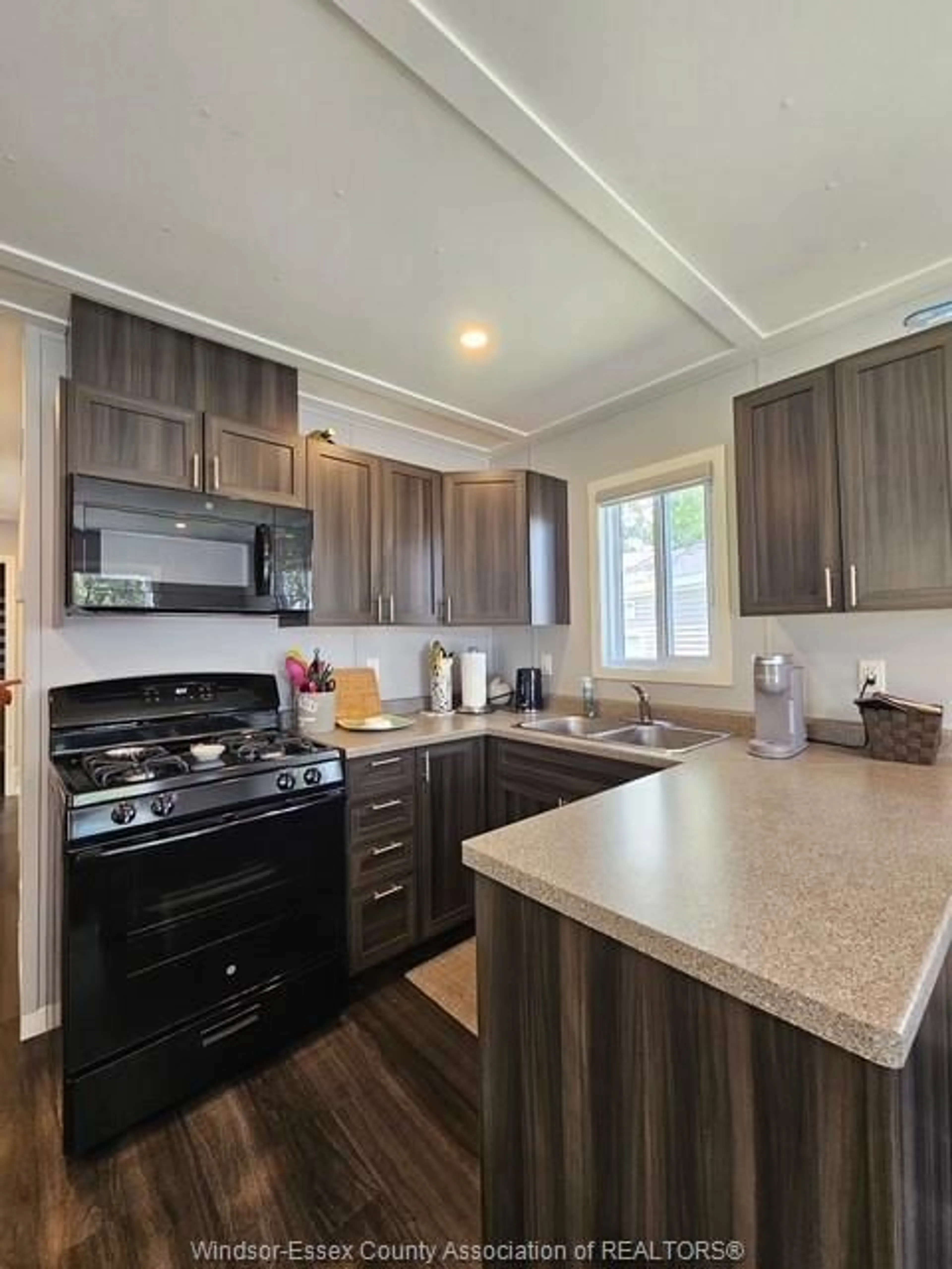 Open concept kitchen, wood/laminate floor for 981 COUNTY RD 2 #439, Lakeshore Ontario N0R 1A0