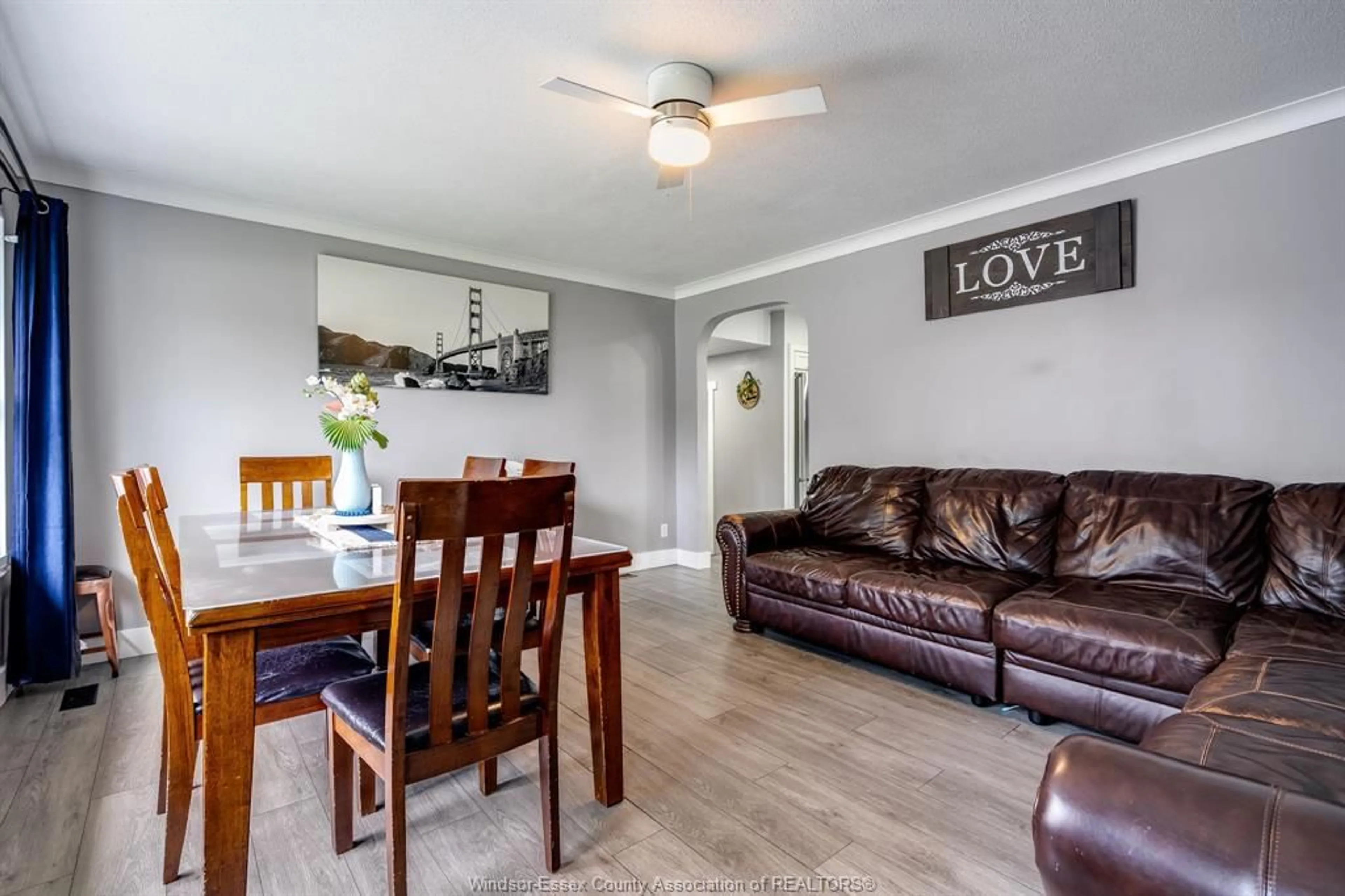 Living room with furniture, wood/laminate floor for 104 Danforth Ave, Leamington Ontario N8H 2R2