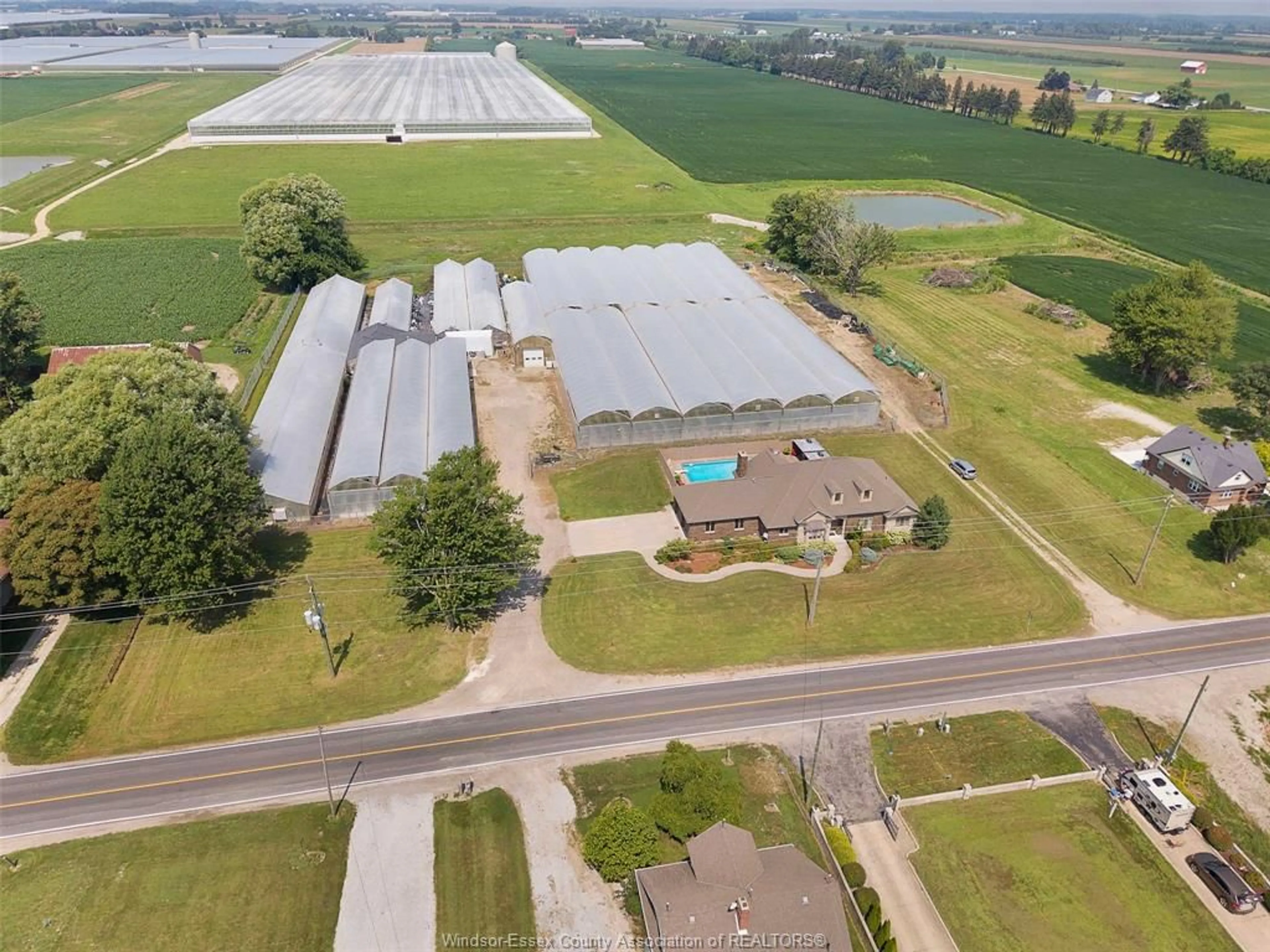 A pic from outside/outdoor area/front of a property/back of a property/a pic from drone, building for 1027 MERSEA ROAD 2, Leamington Ontario N8H 3V7