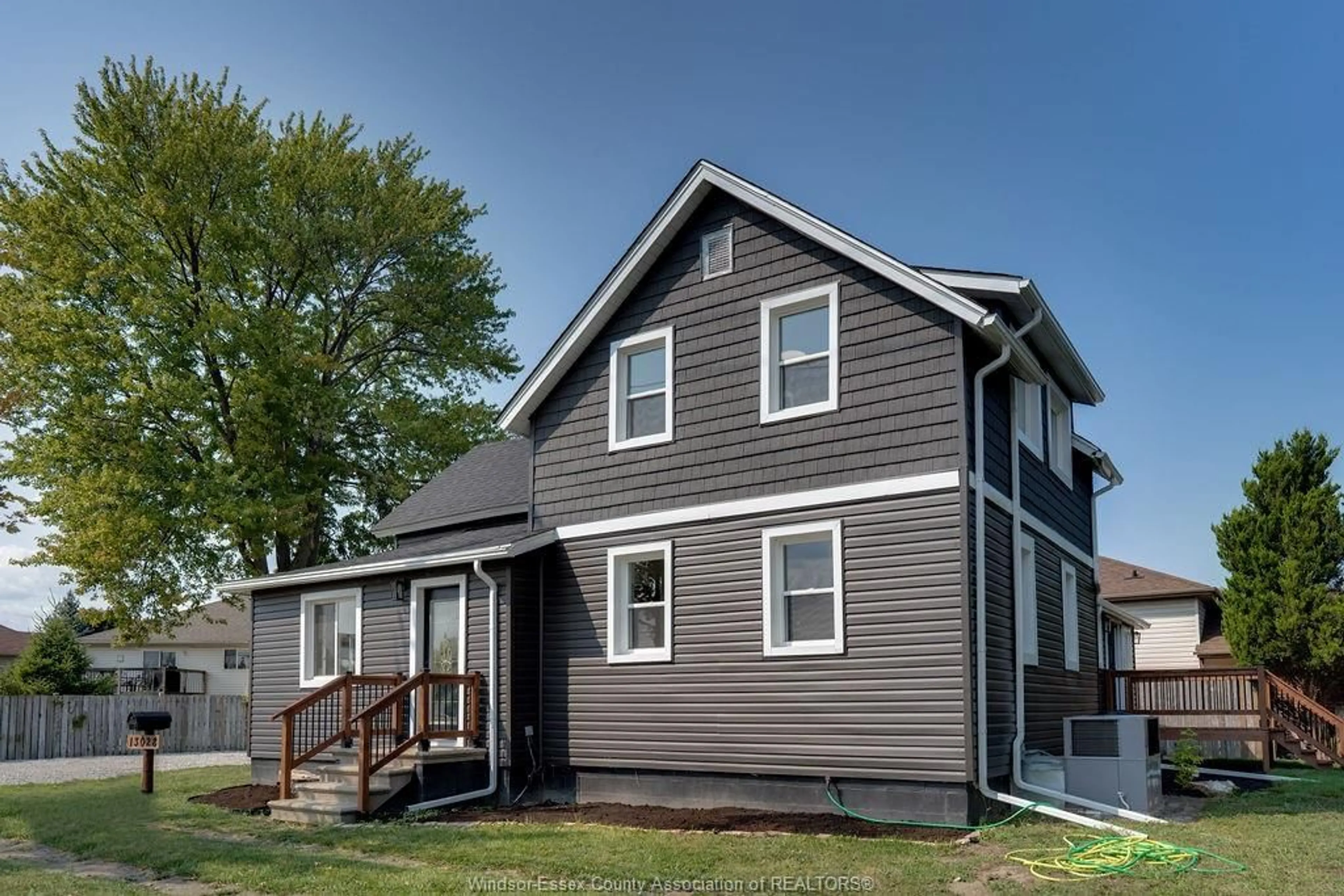 Home with vinyl exterior material, street for 13028 TECUMSEH Rd, Tecumseh Ontario N8N 3T6Q