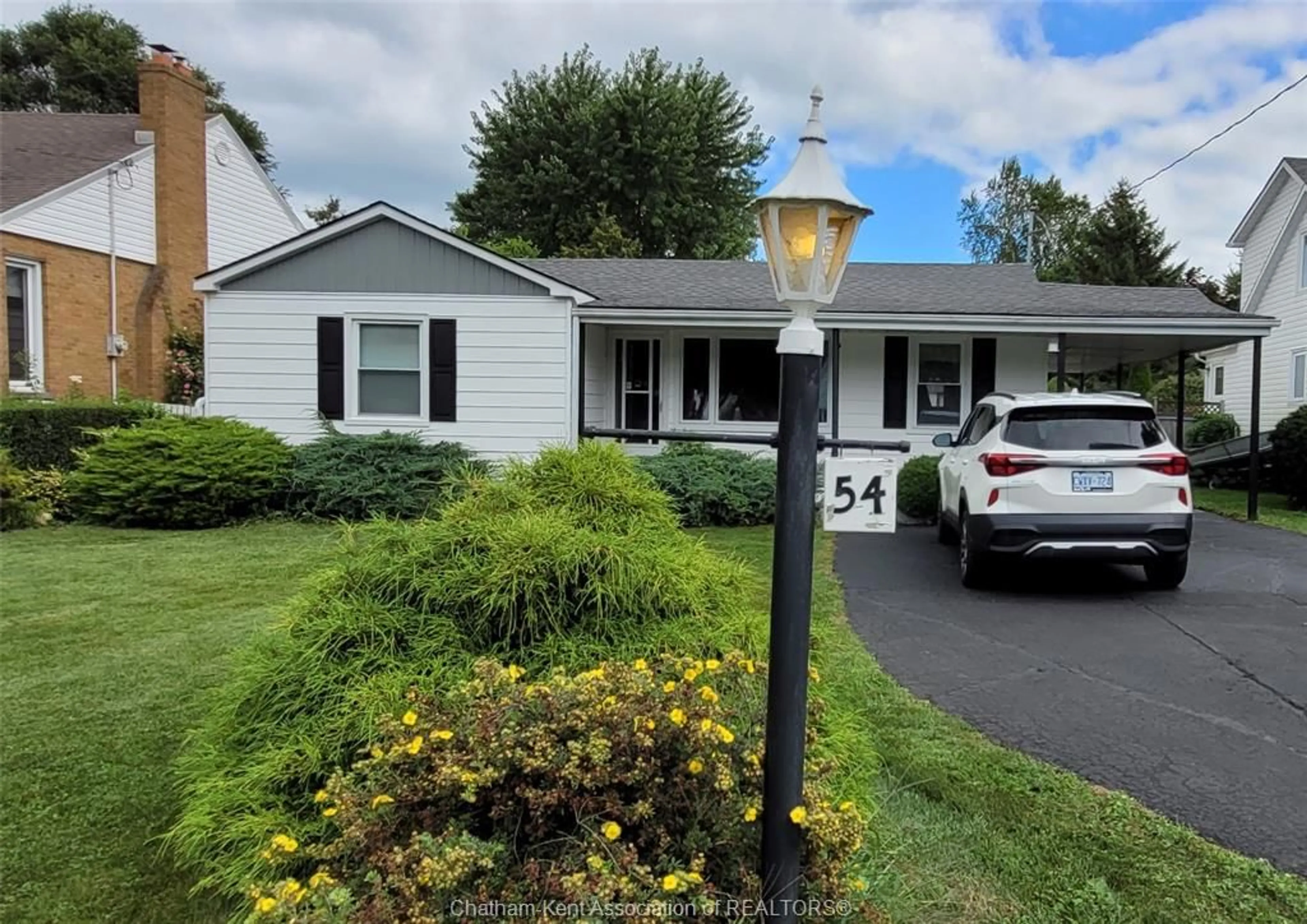 Home with vinyl exterior material, street for 54 Dundas St, Wallaceburg Ontario N8A 2J2